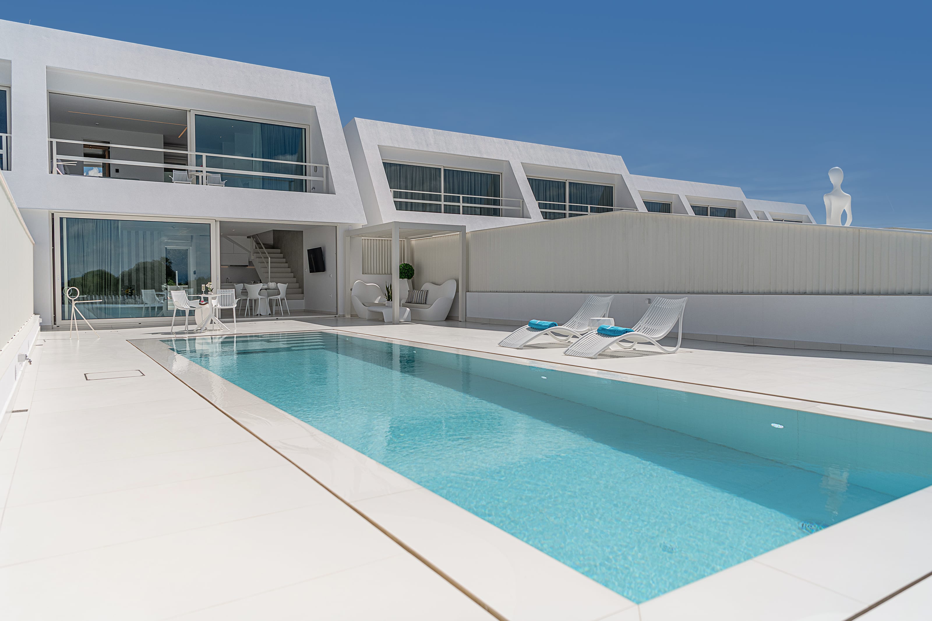 a swimming pool in front of a house
