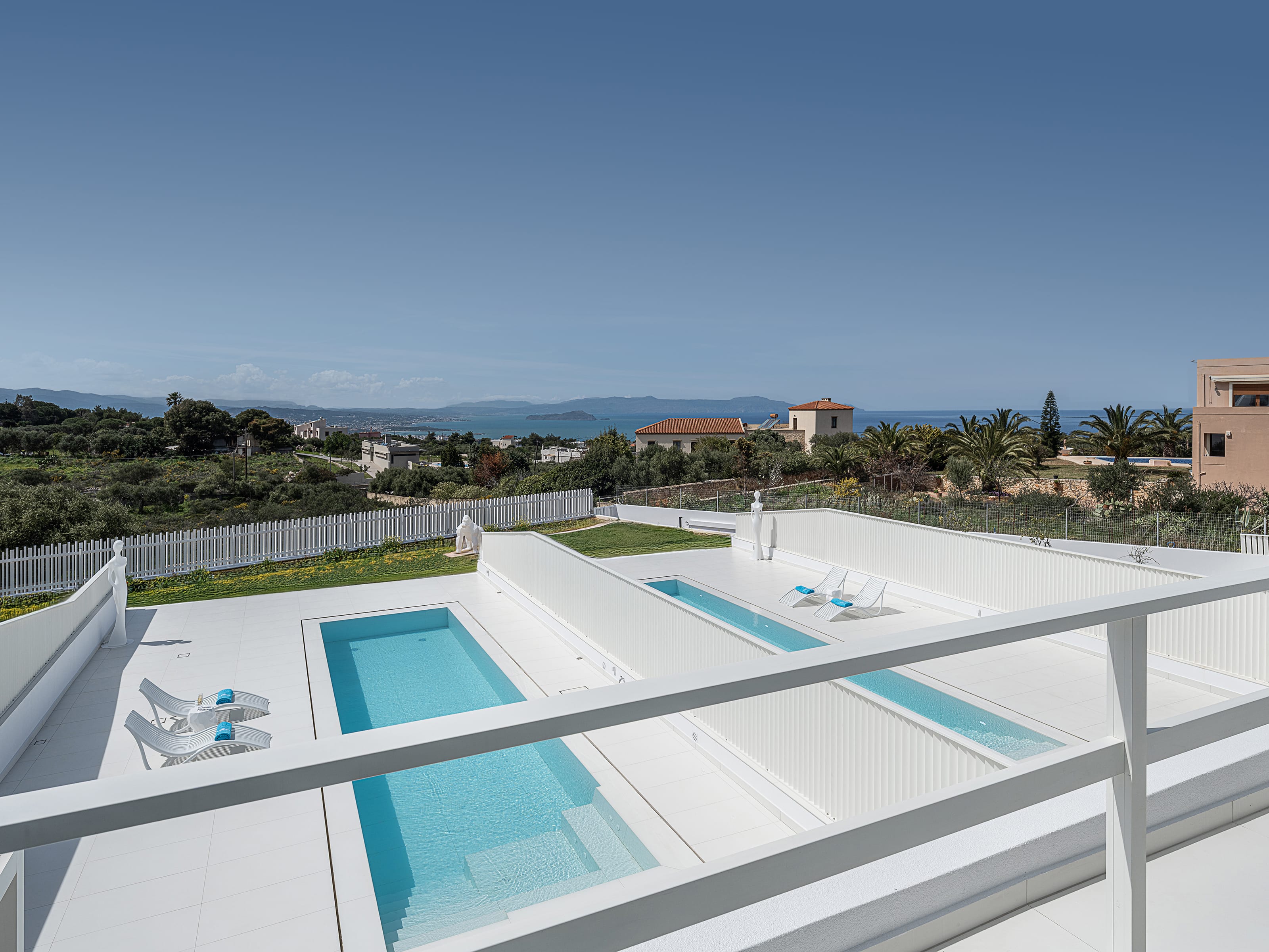a roof with a pool and trees in the background