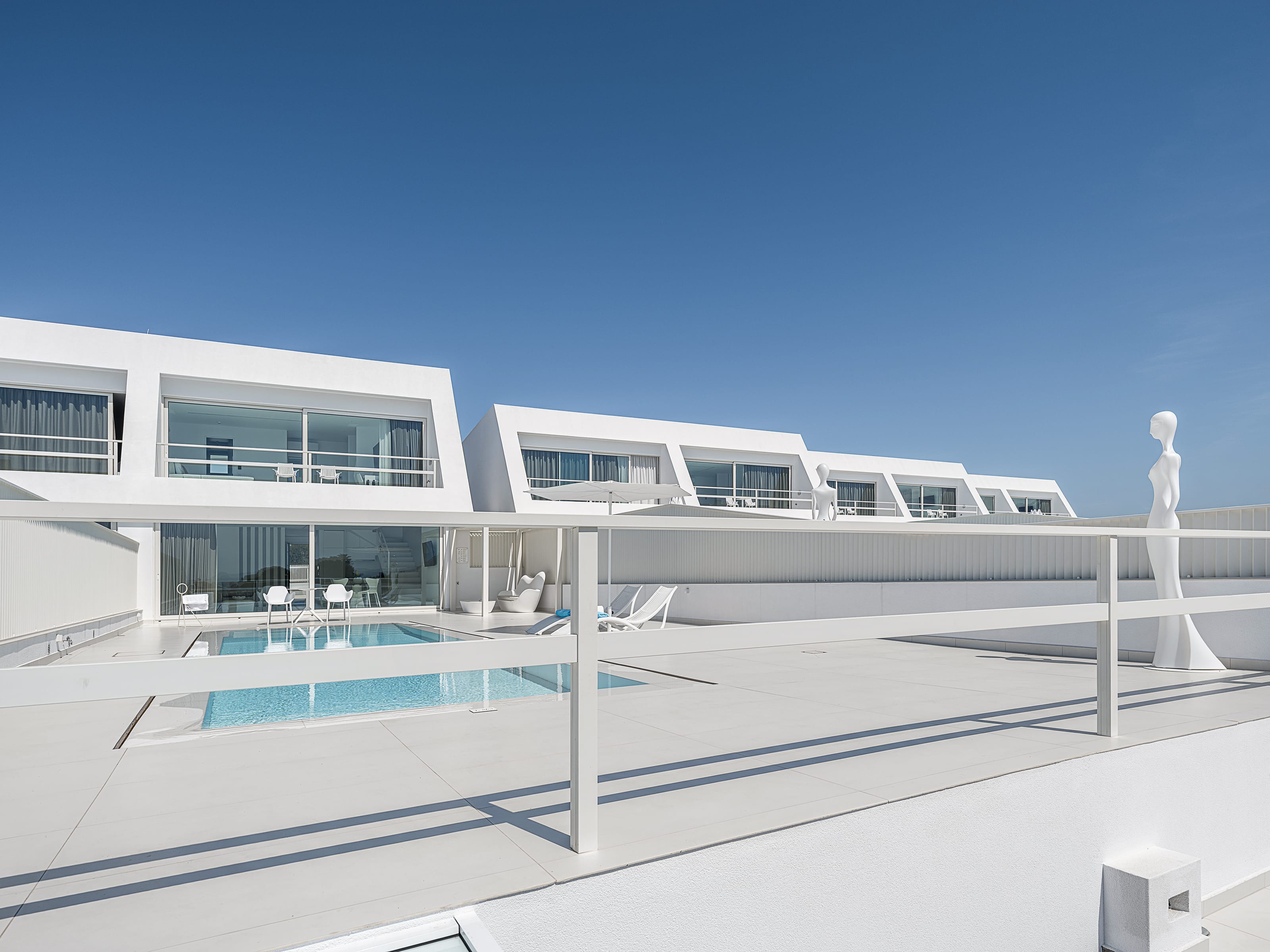 a white building with a pool