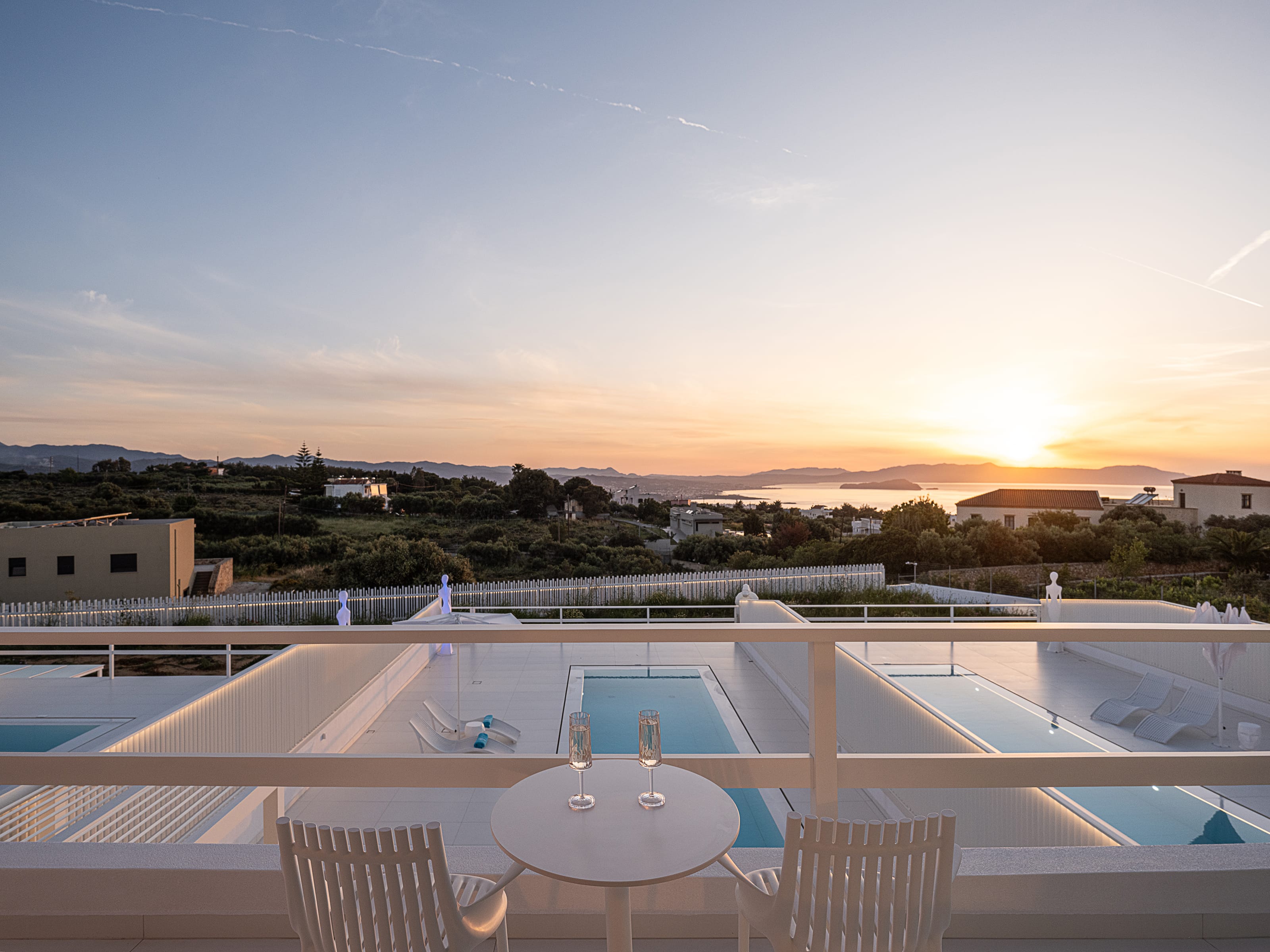 a deck with a pool and a table