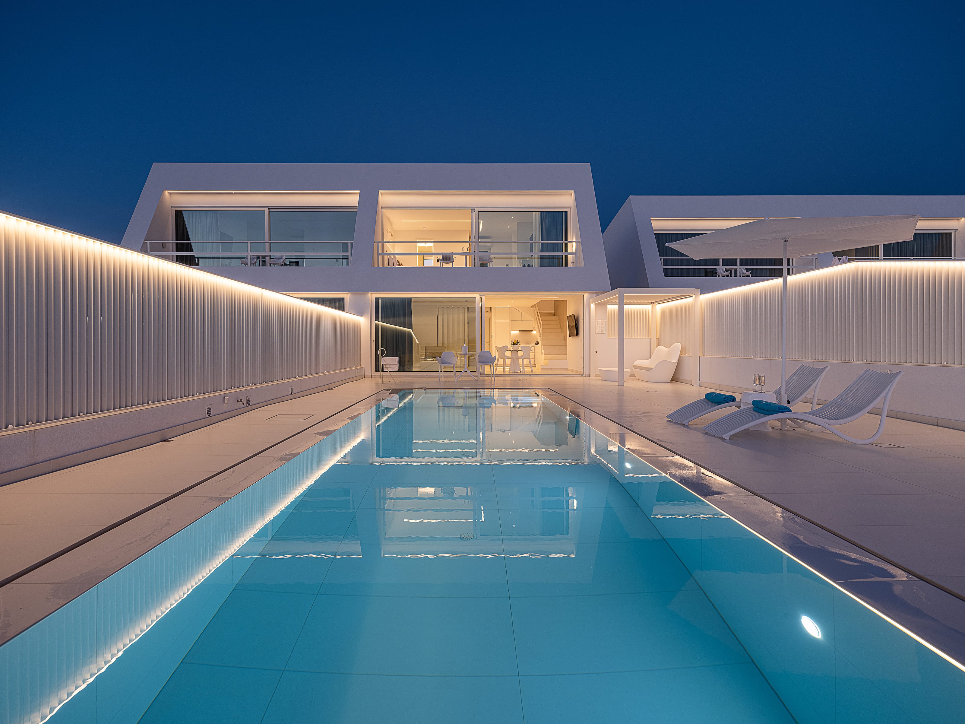 a swimming pool with a building in the background