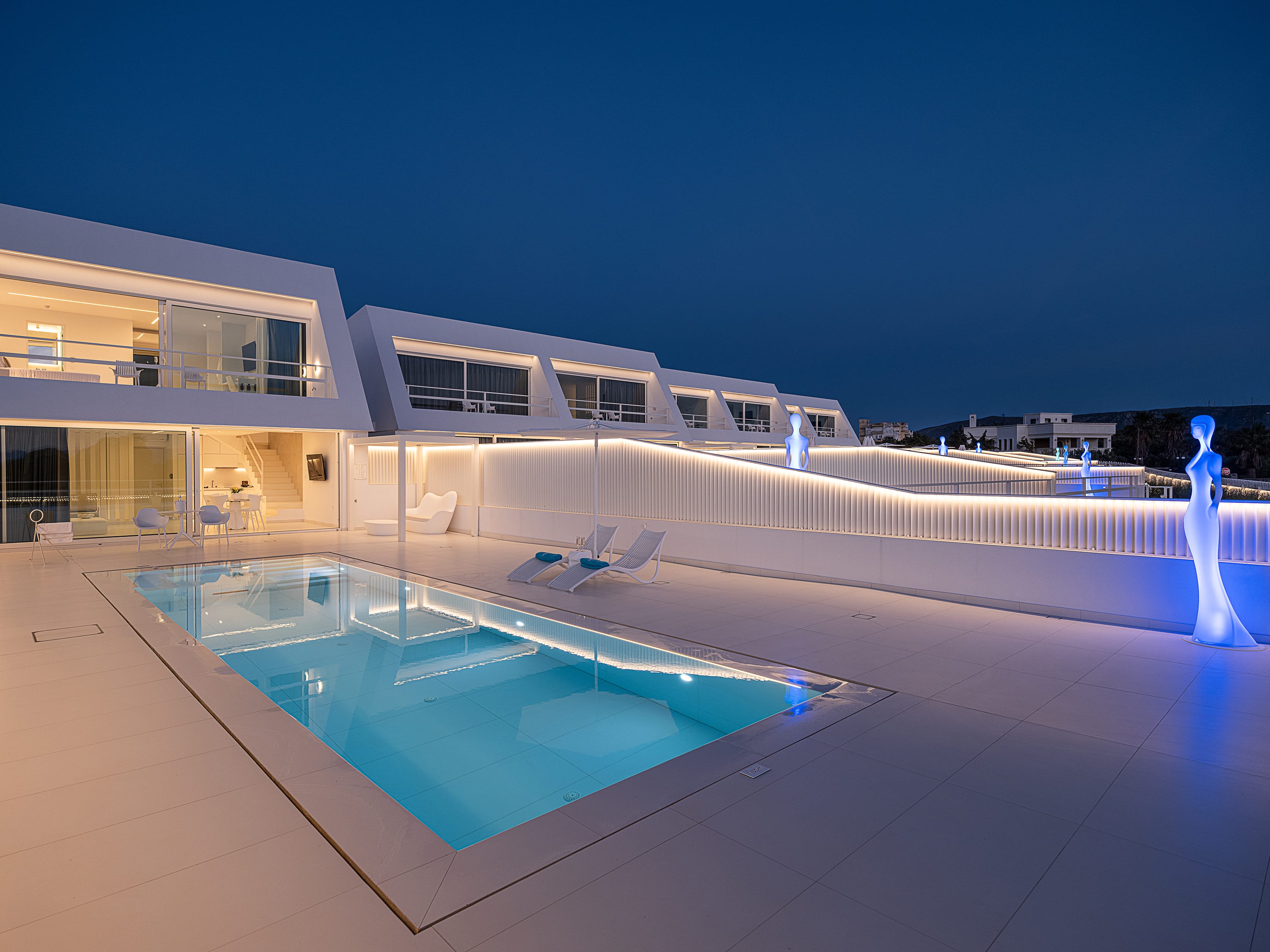 a pool and a house with lights