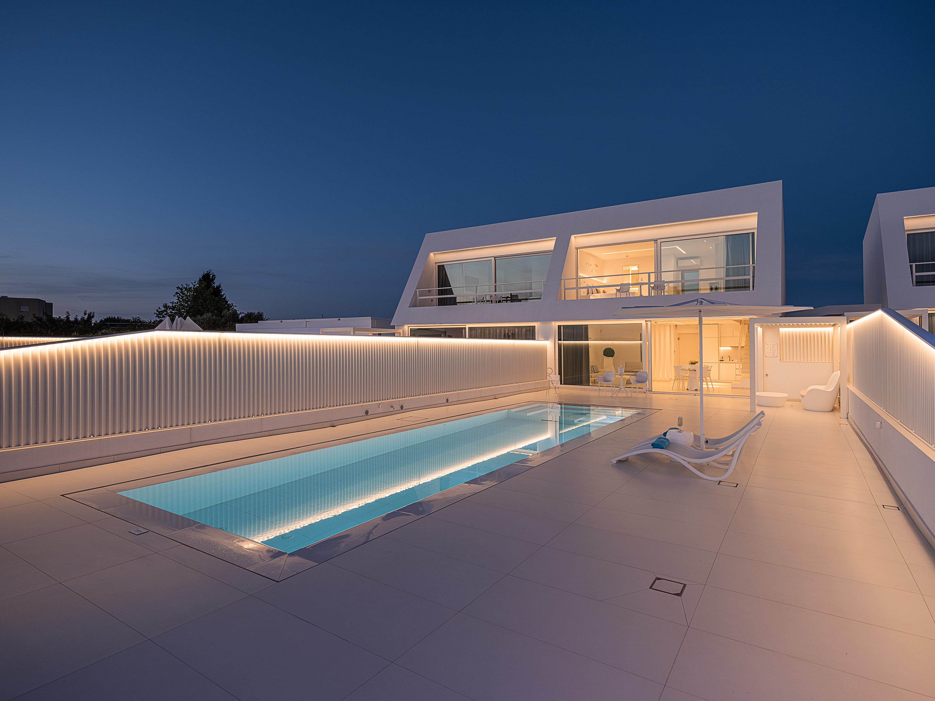 a pool in front of a house
