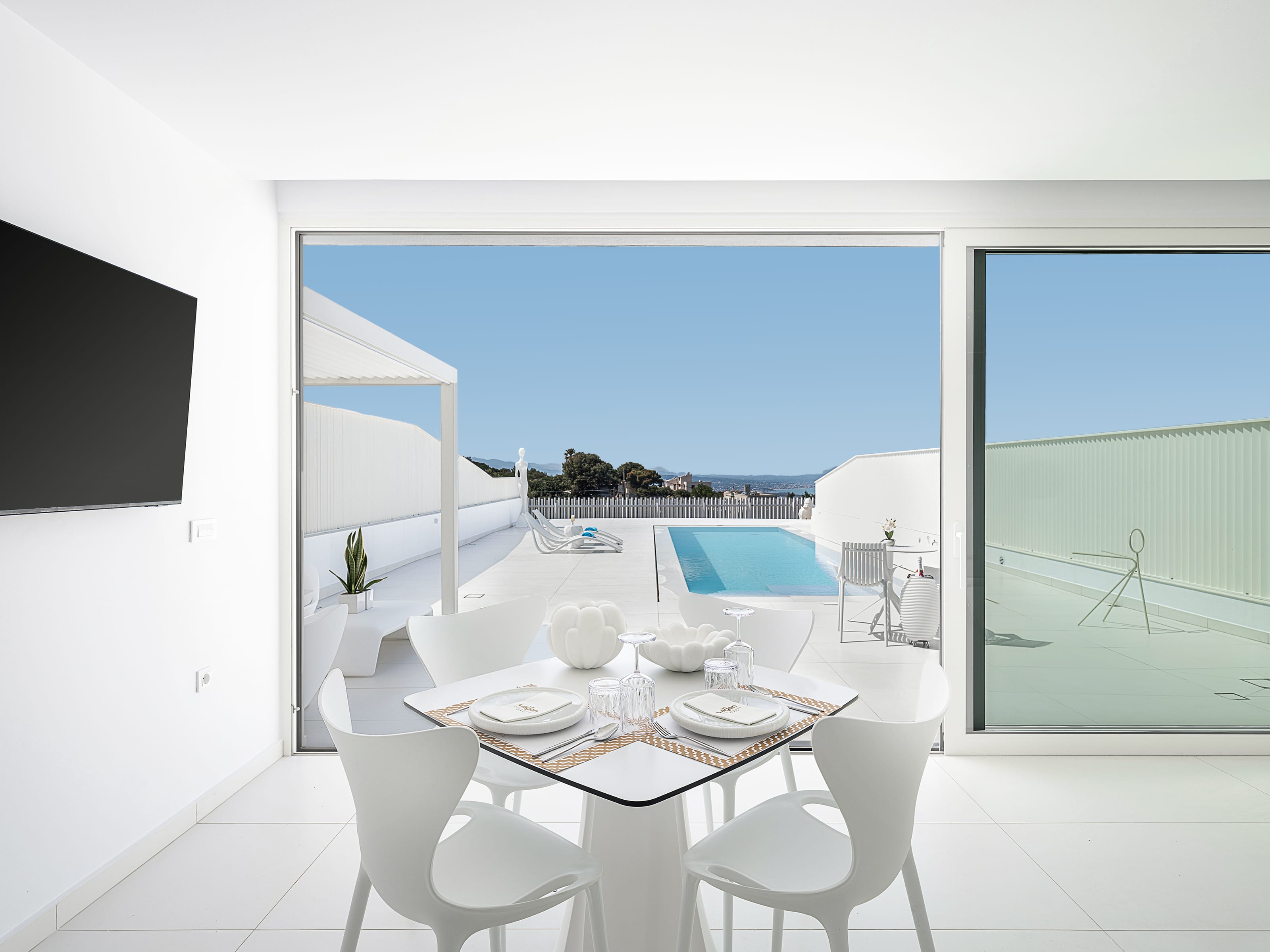 a dining room with a view of the ocean