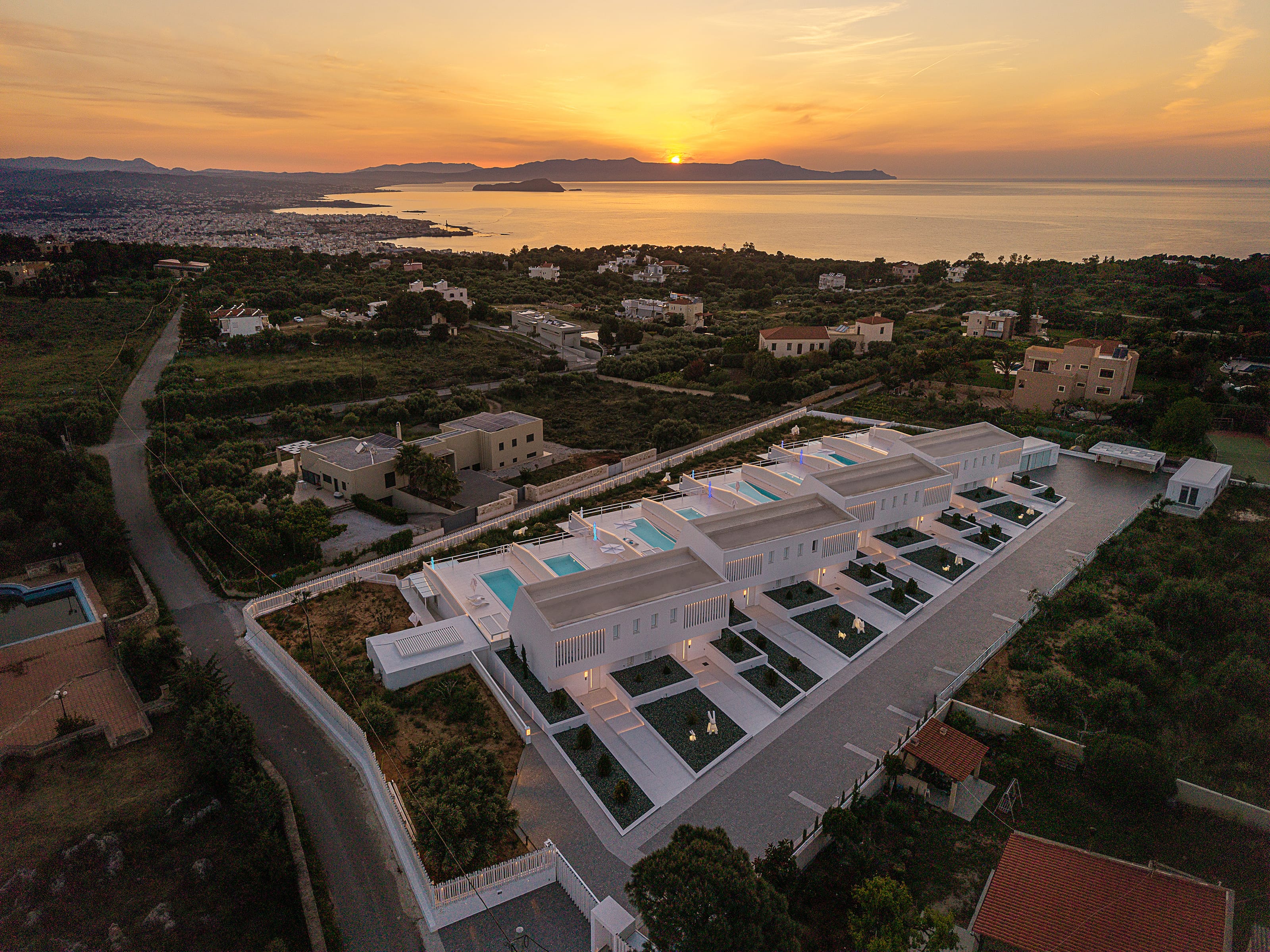 a large building with a pool in the middle of a city
