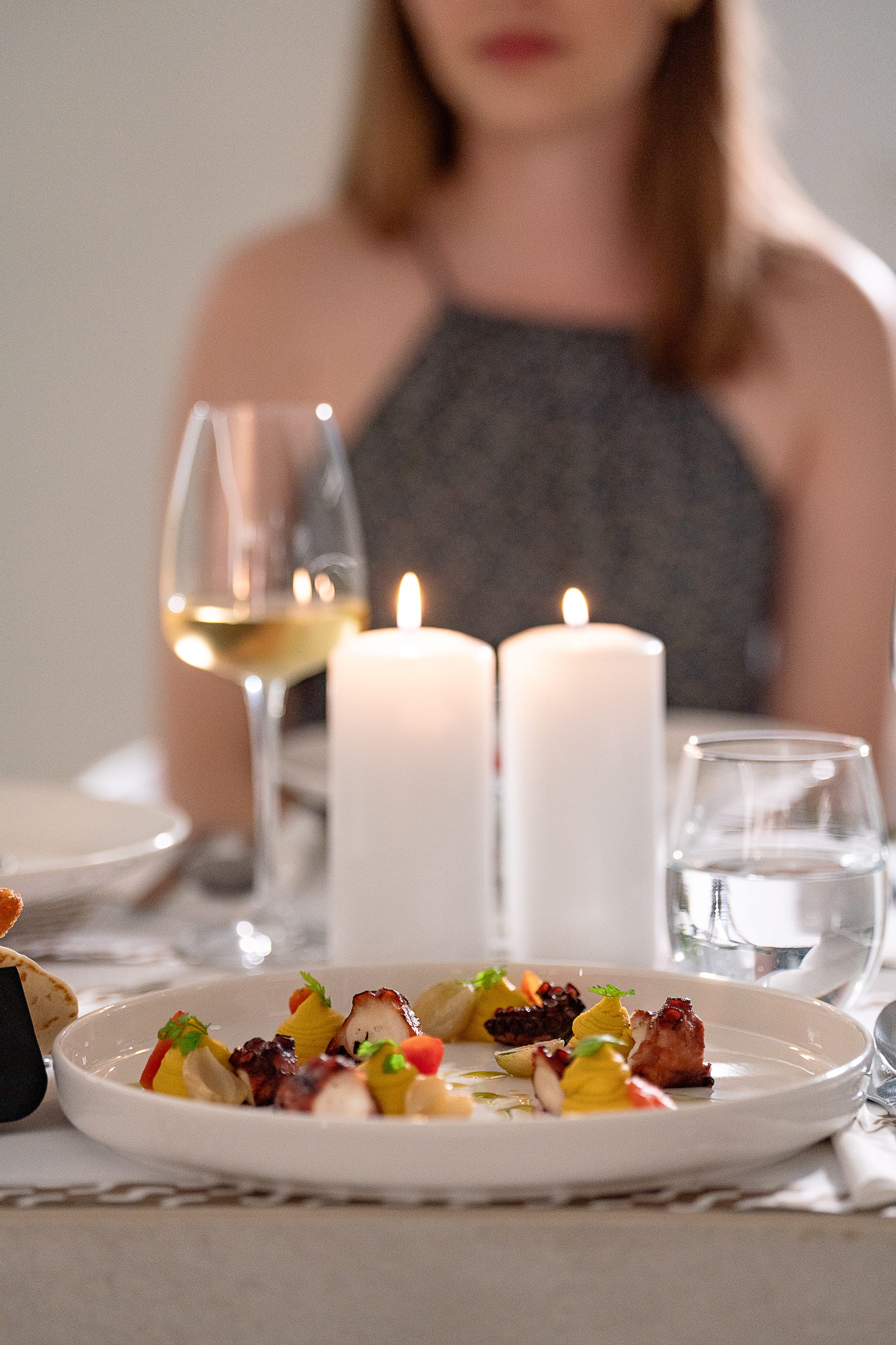 a plate of food and glasses