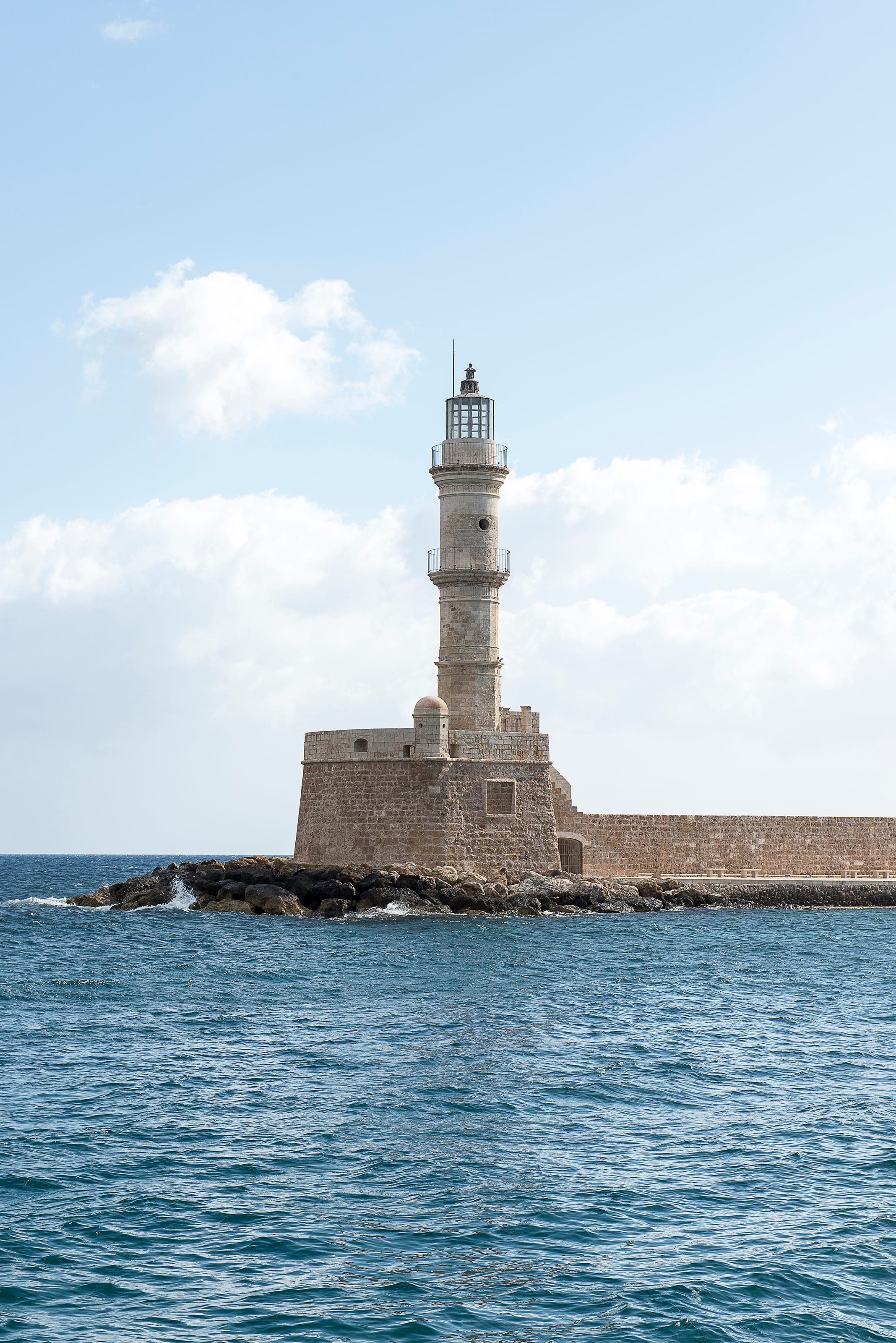 a lighthouse on a rocky island