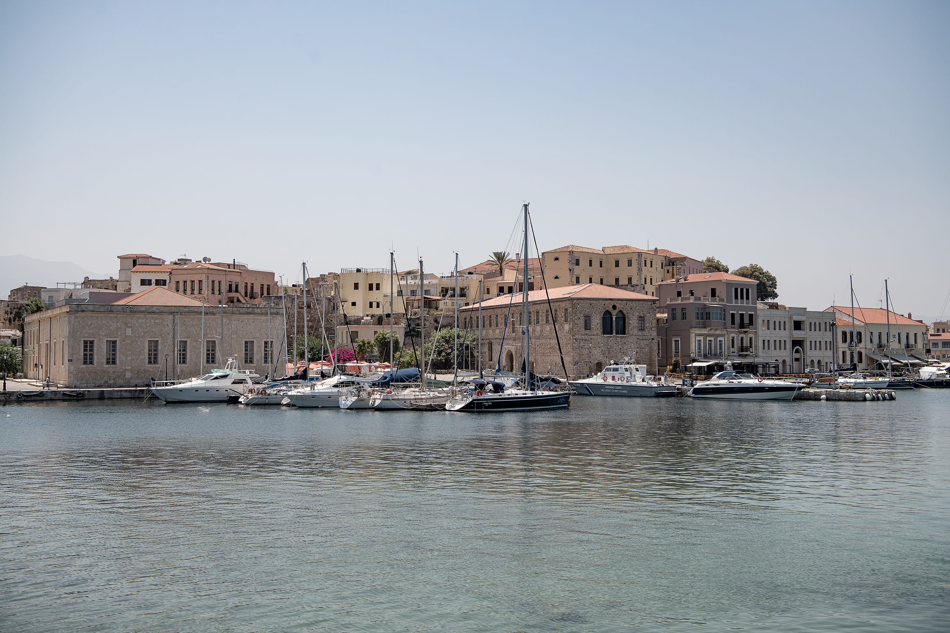a body of water with boats in it and buildings around it