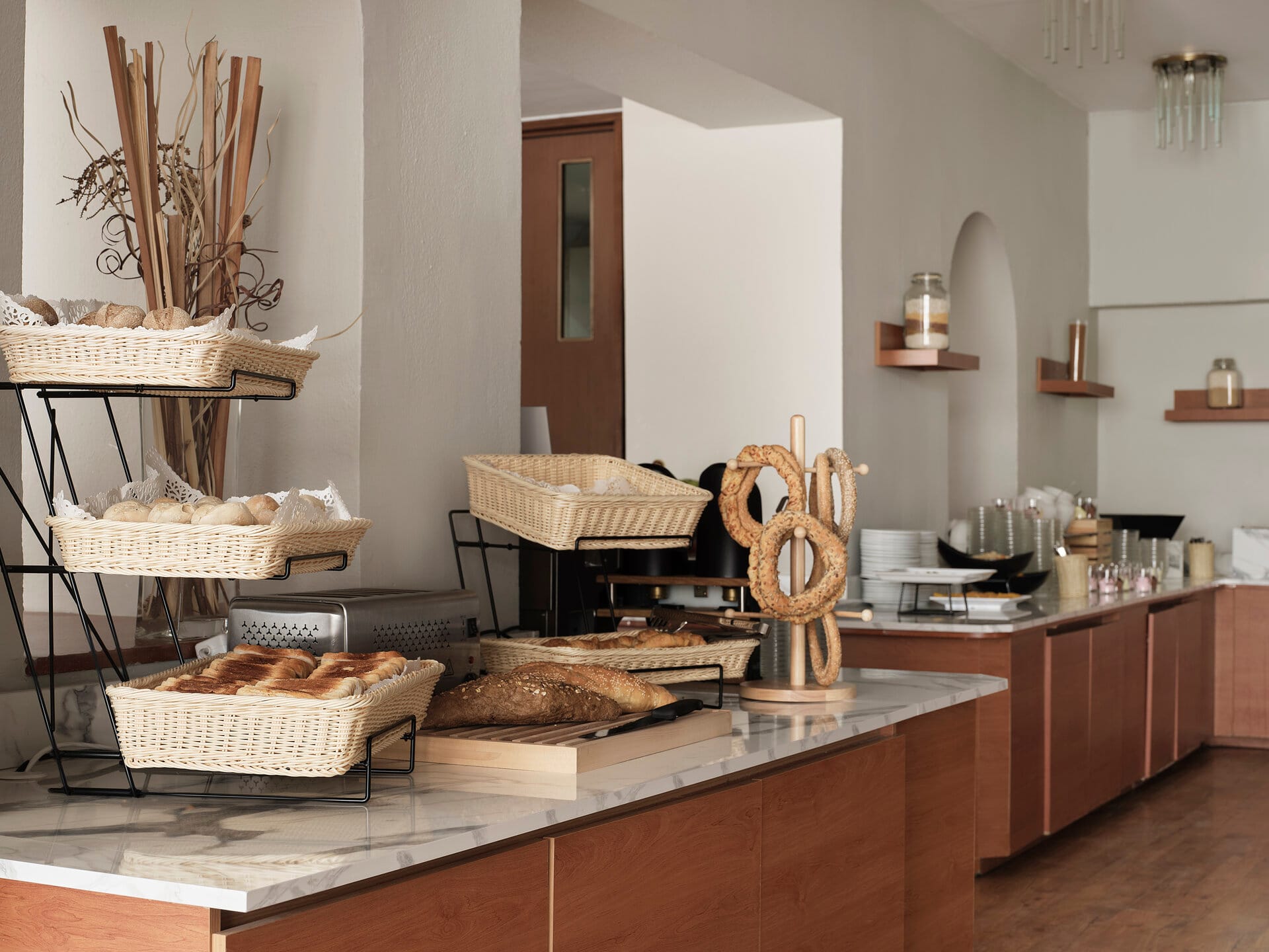 a kitchen with a table and shelves