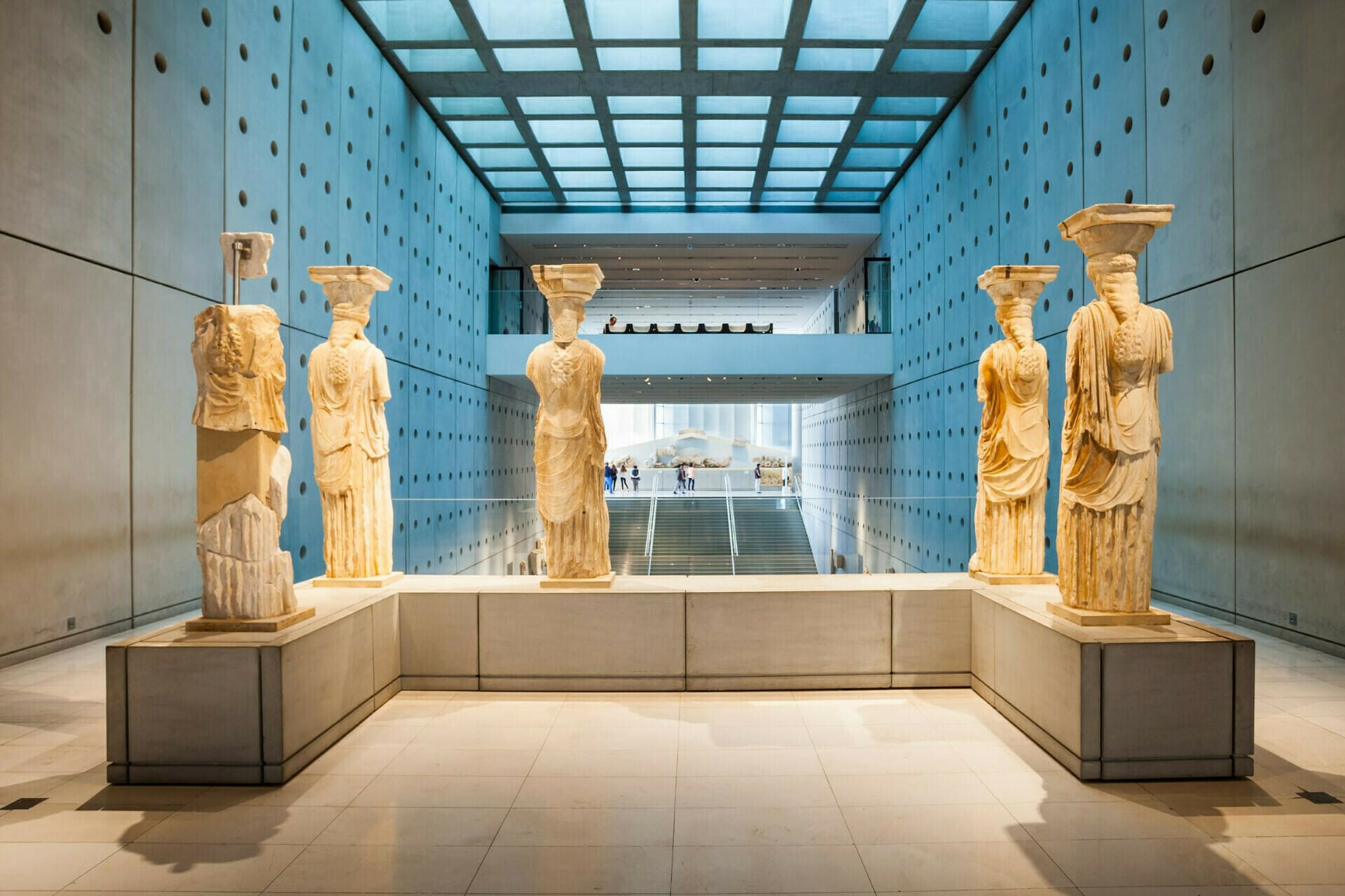 a group of statues in a museum