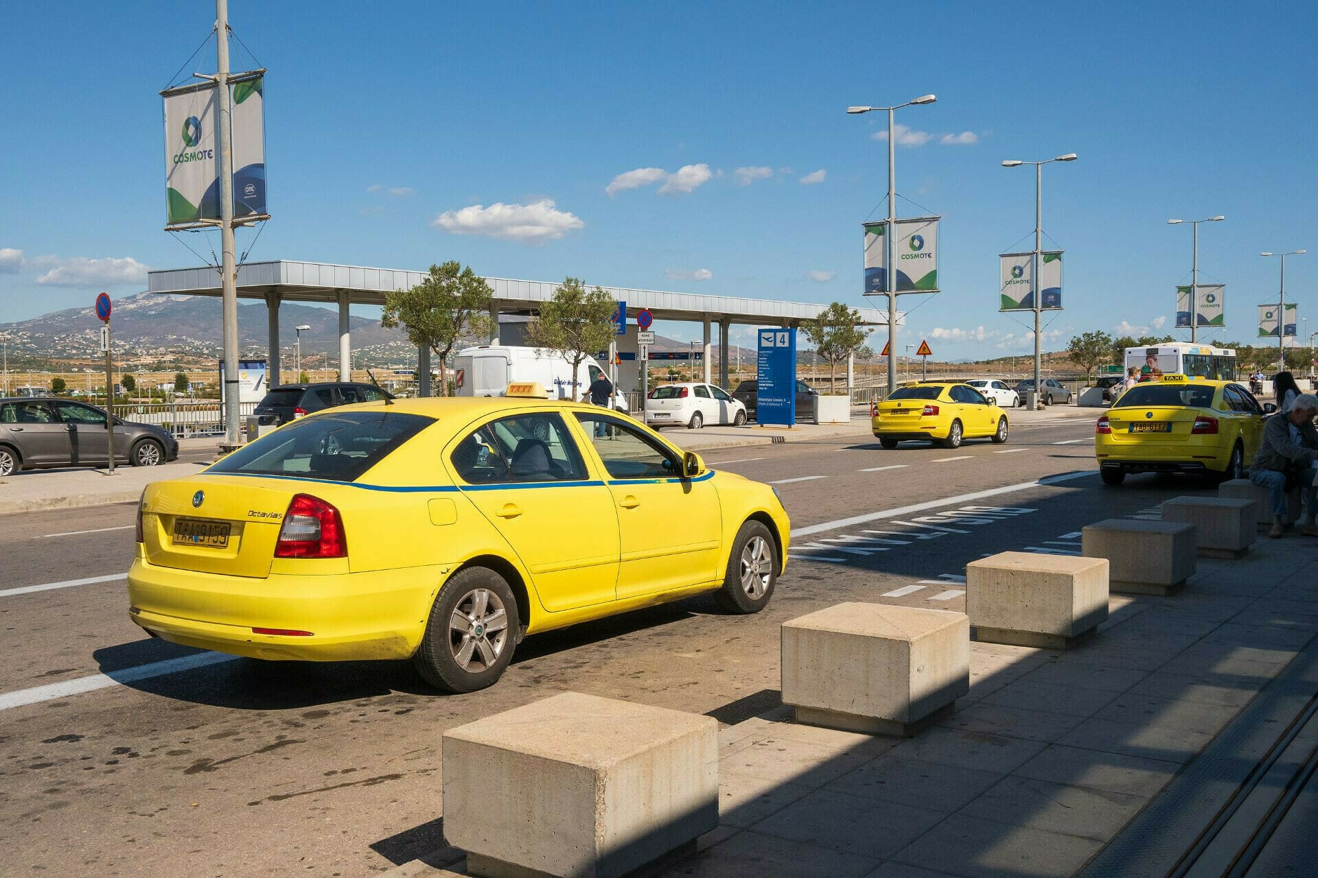a yellow car on a road
