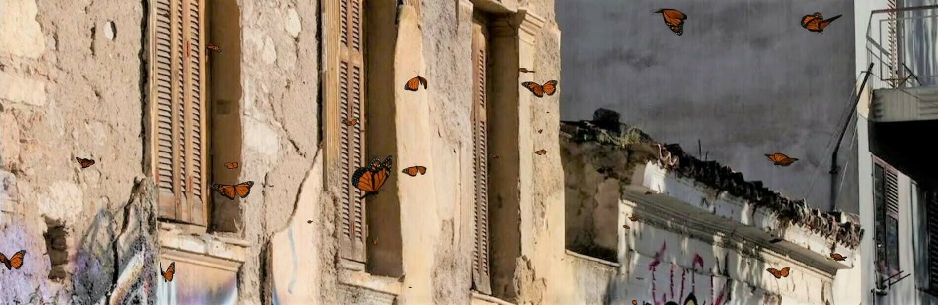 a street with buildings and a cloudy sky