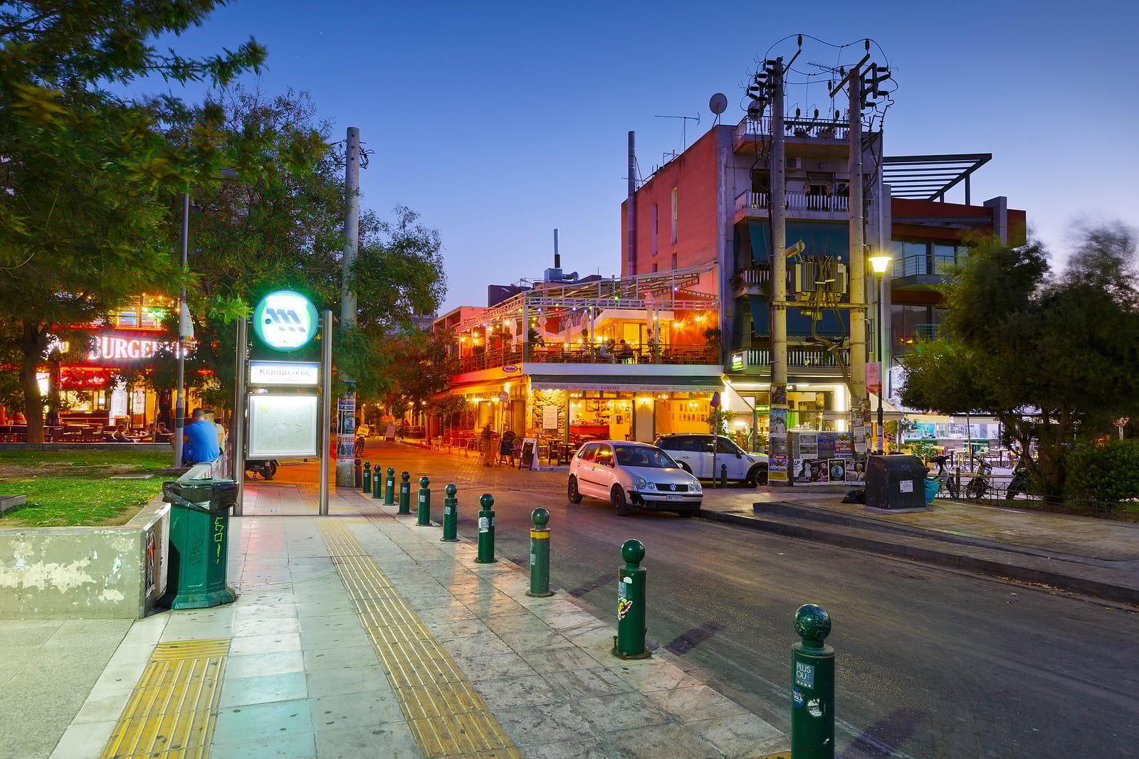 a street with cars and buildings