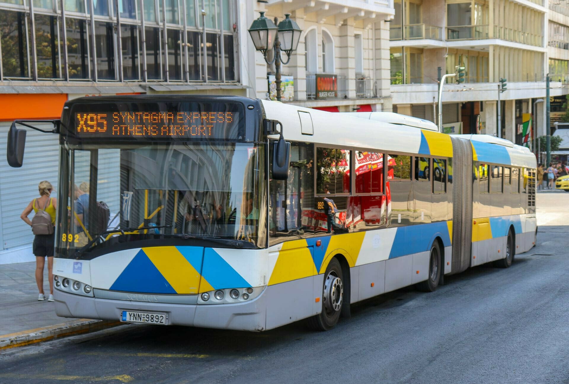 a bus travels down the street
