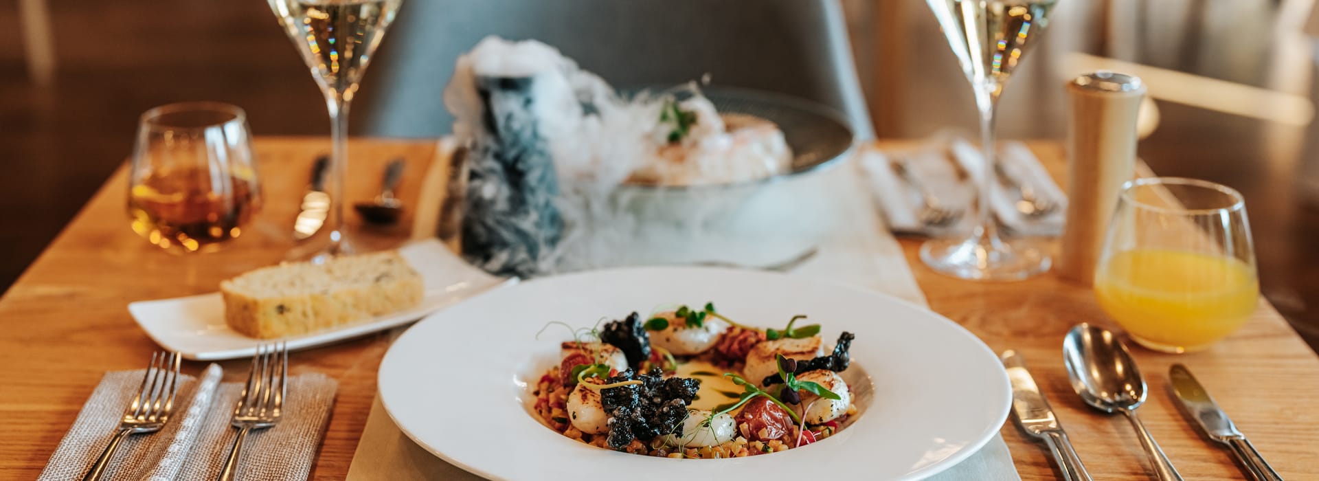a table with plates and glasses