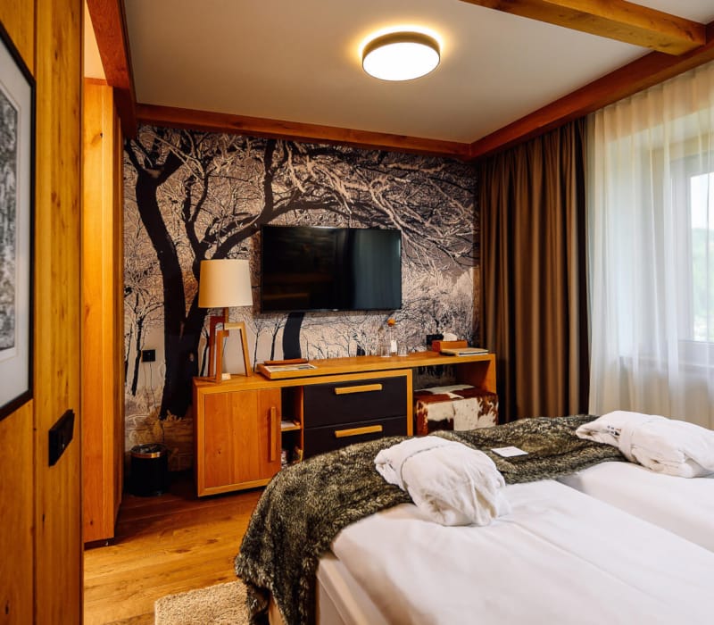 a bedroom with a bed and a dresser