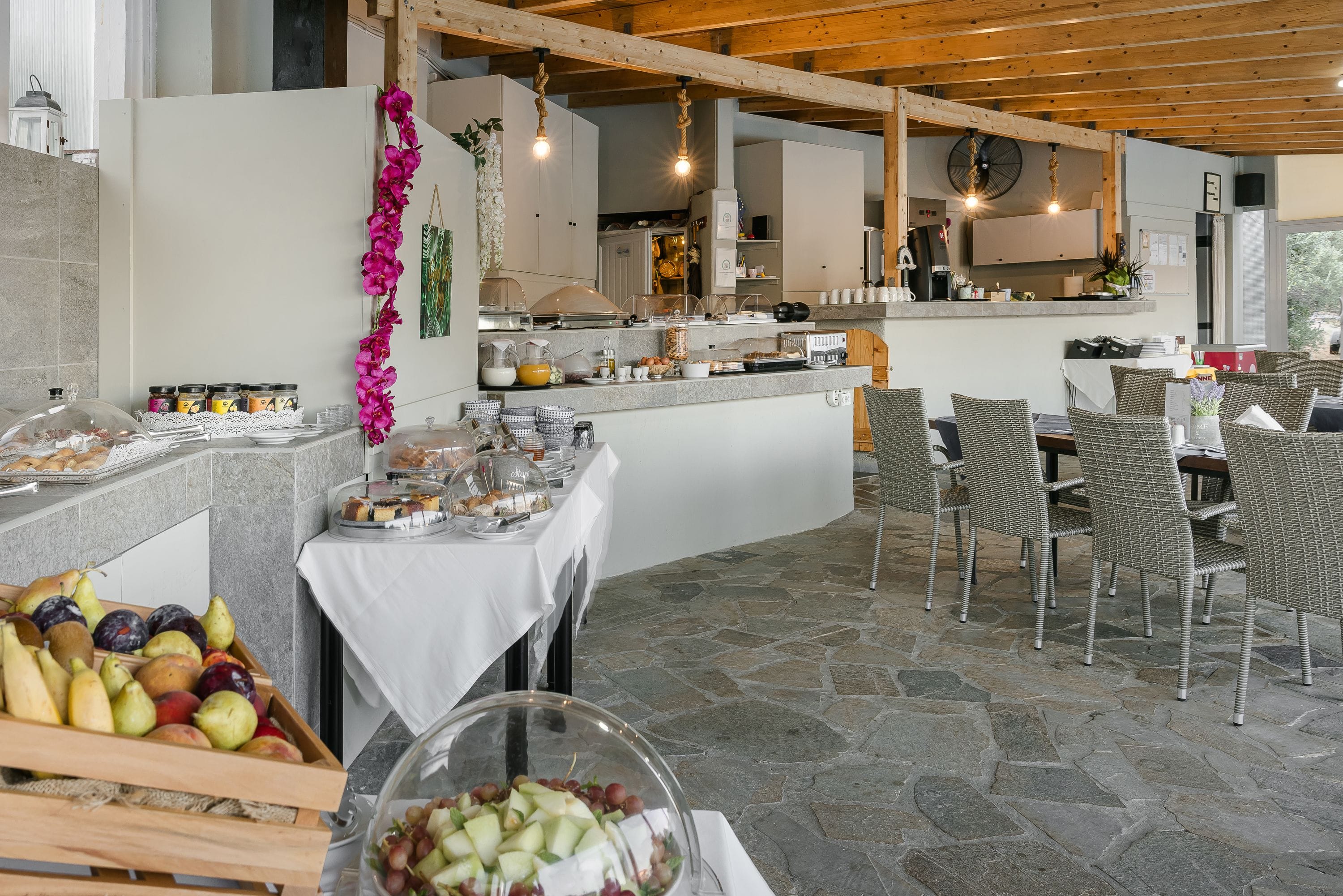 a large kitchen with a table and chairs