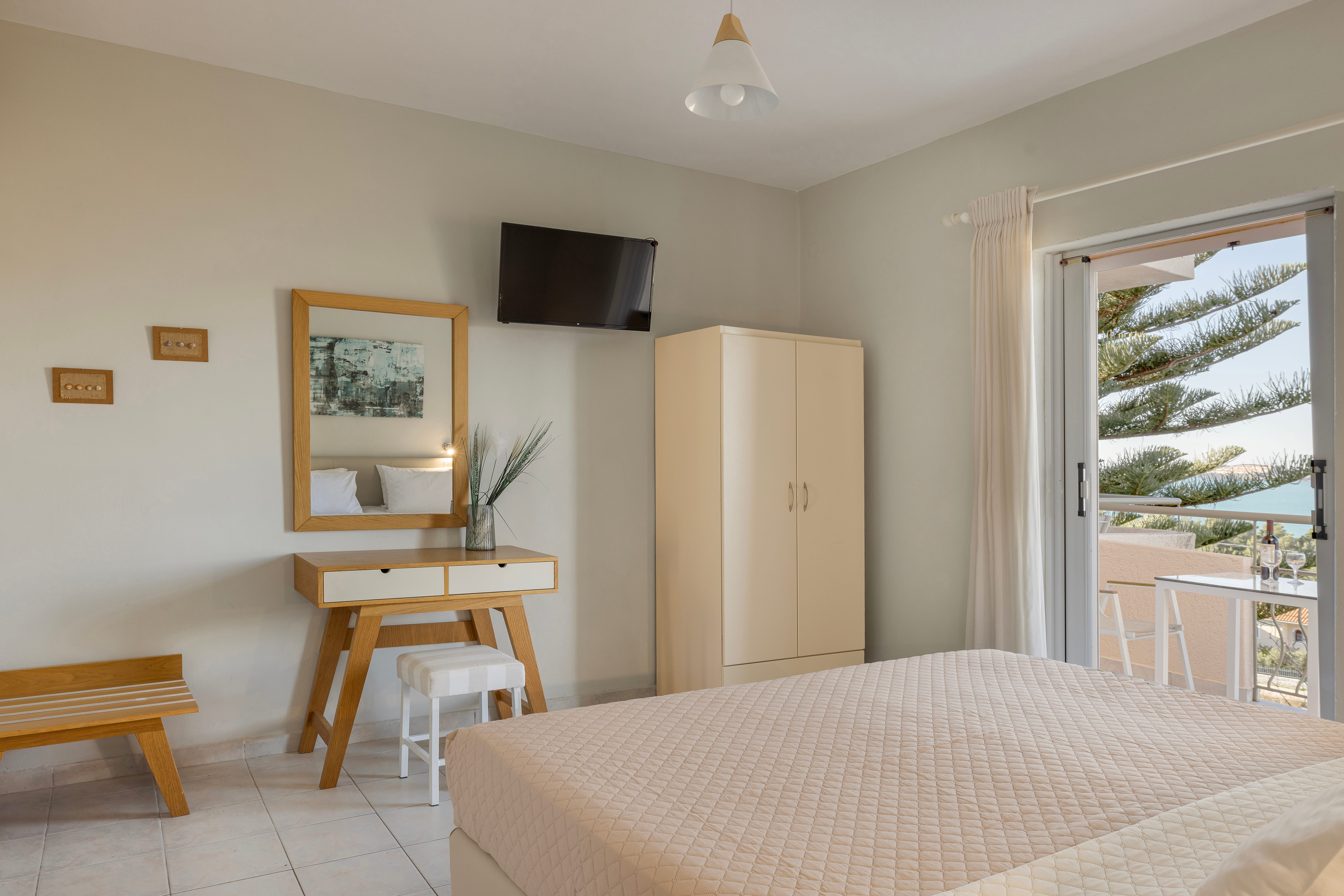 a bedroom with a bed and a tv