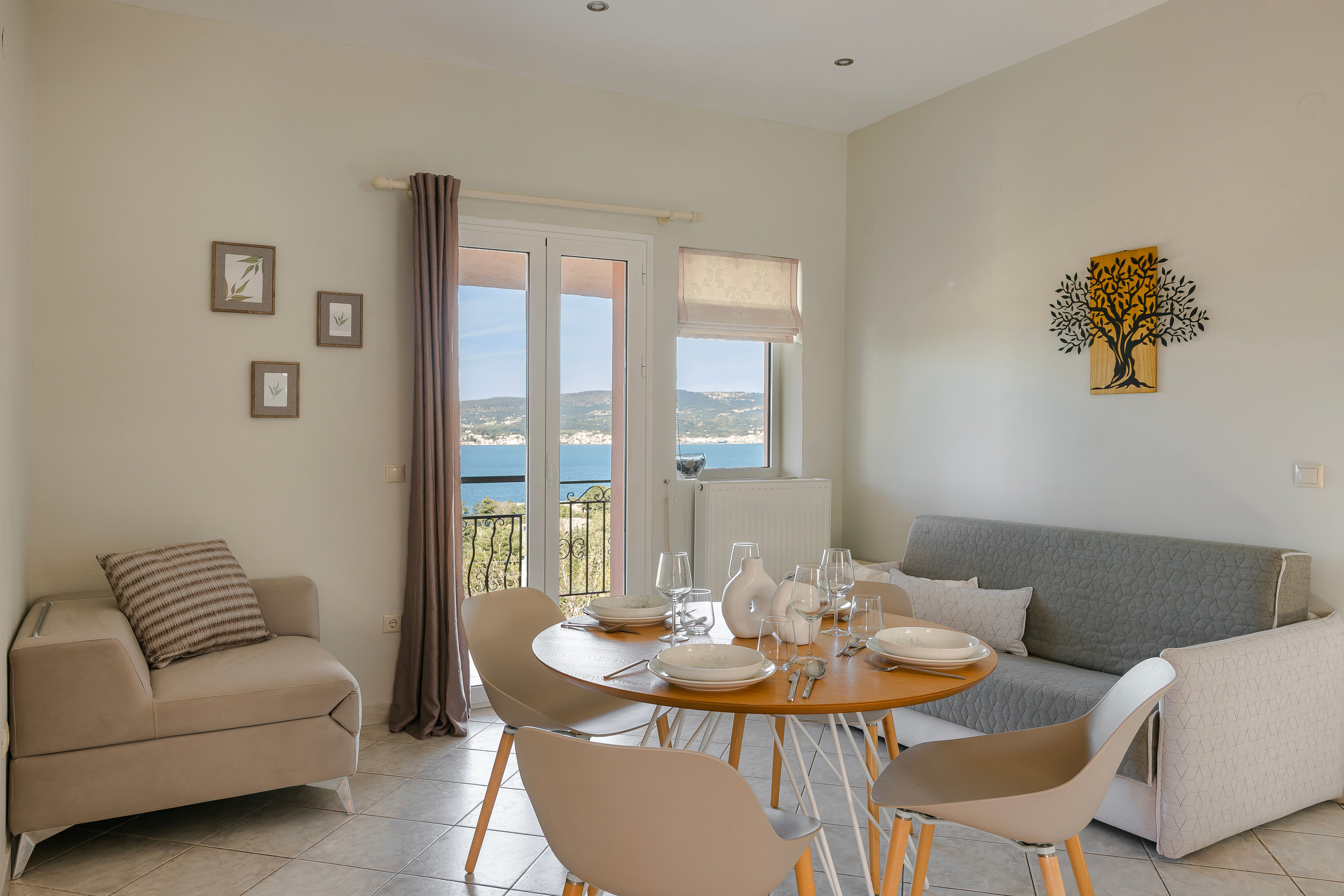 a living room with a dining table and couches