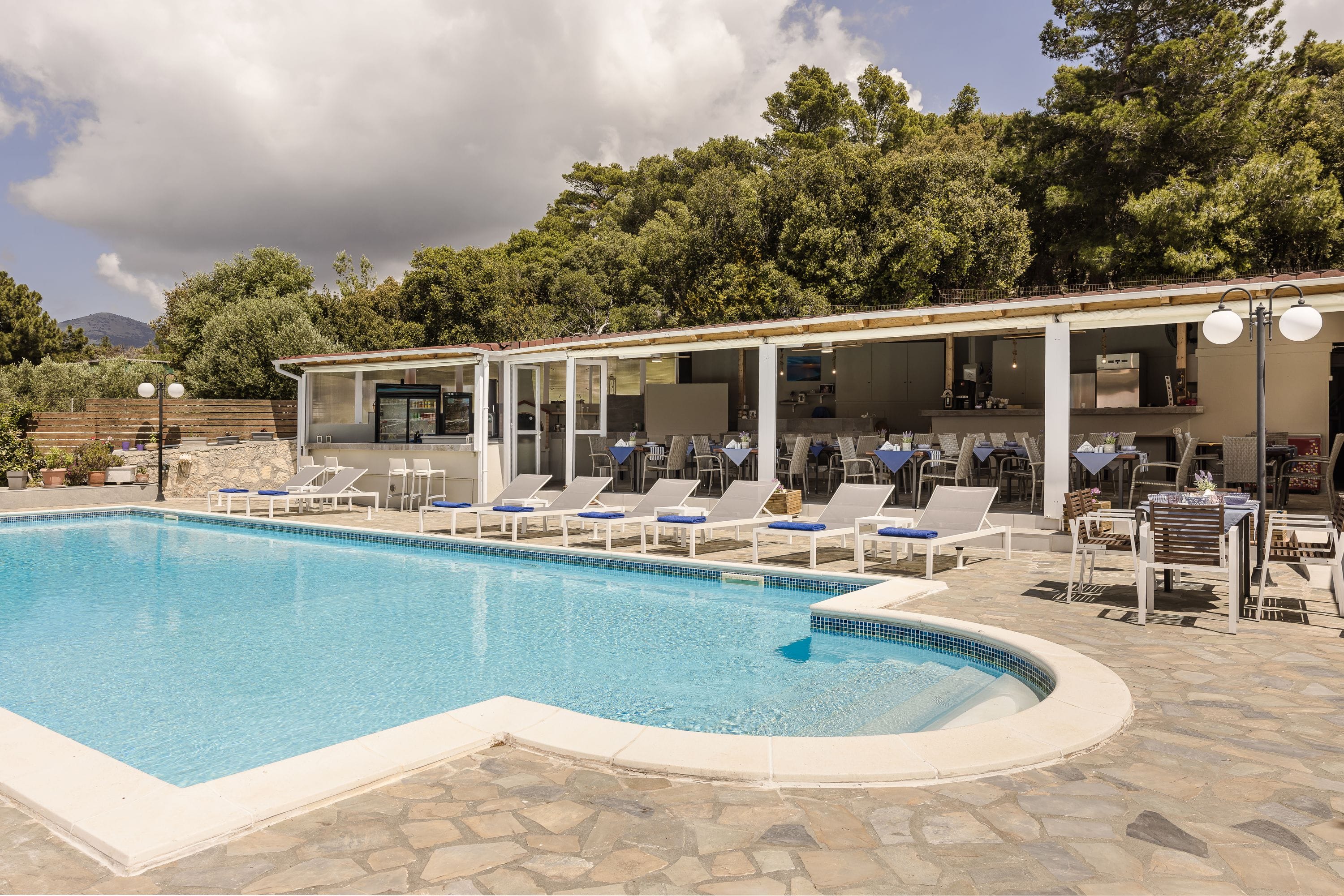 a pool with chairs around it