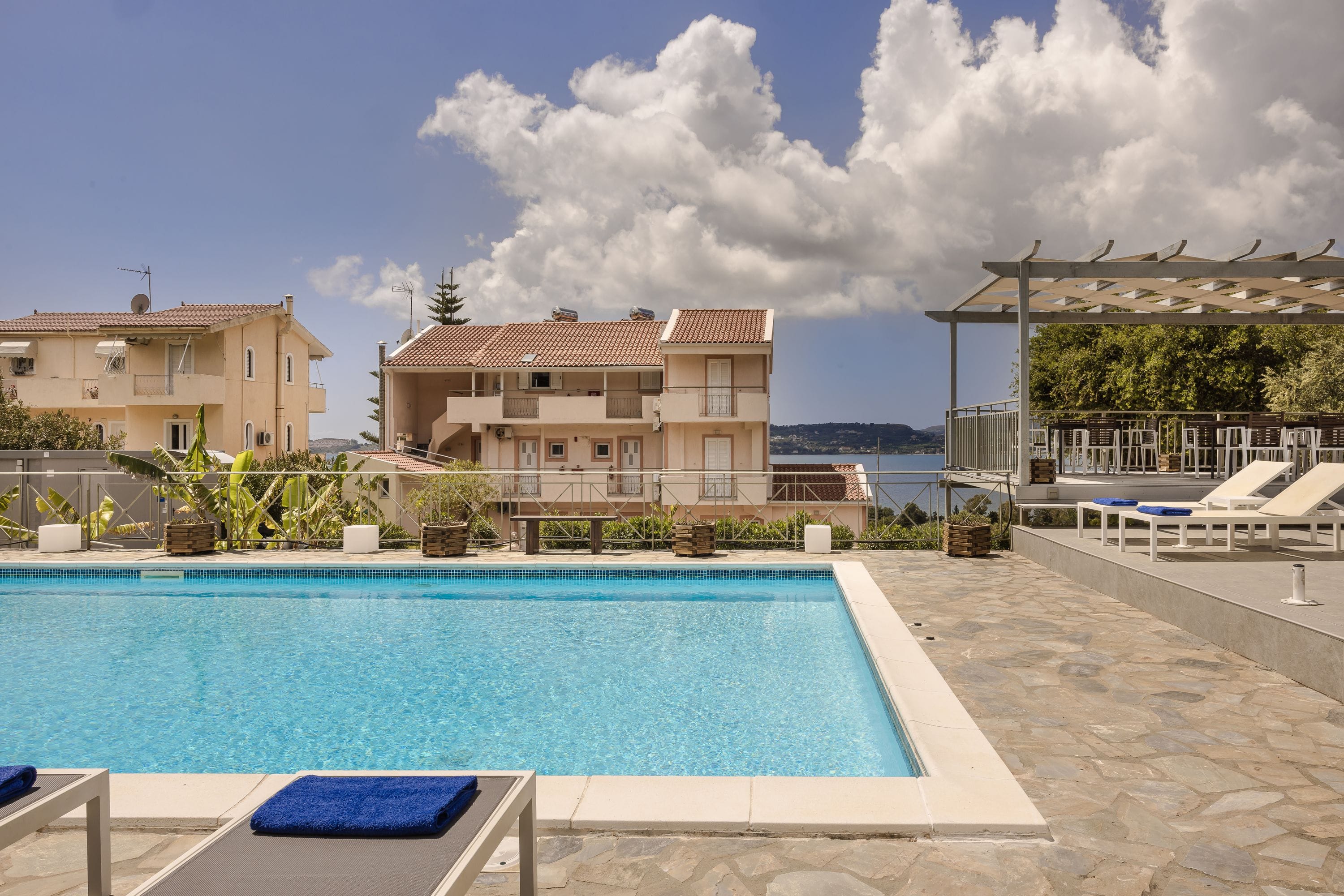 a swimming pool with a building in the background