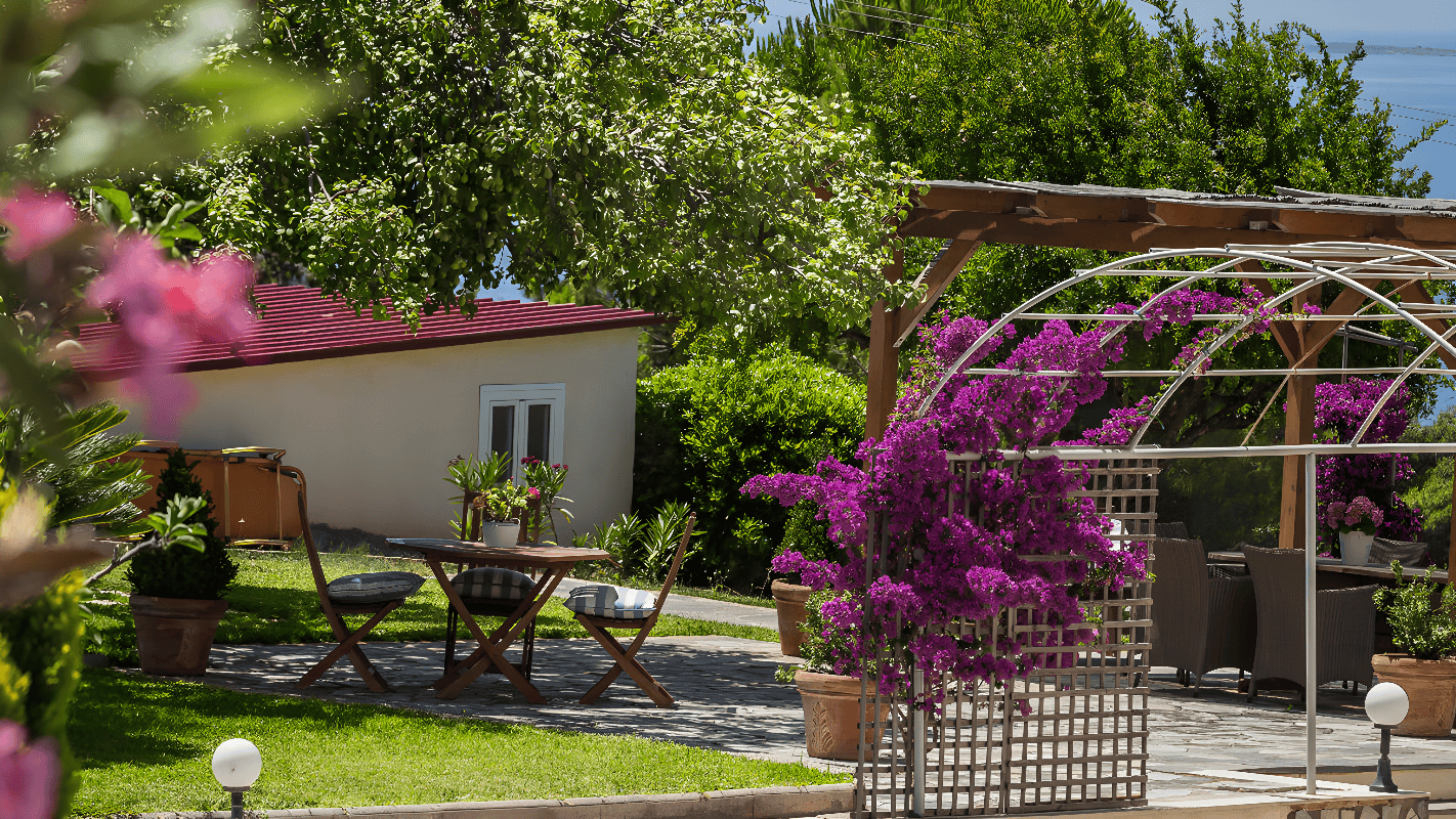 a backyard with a table and chairs
