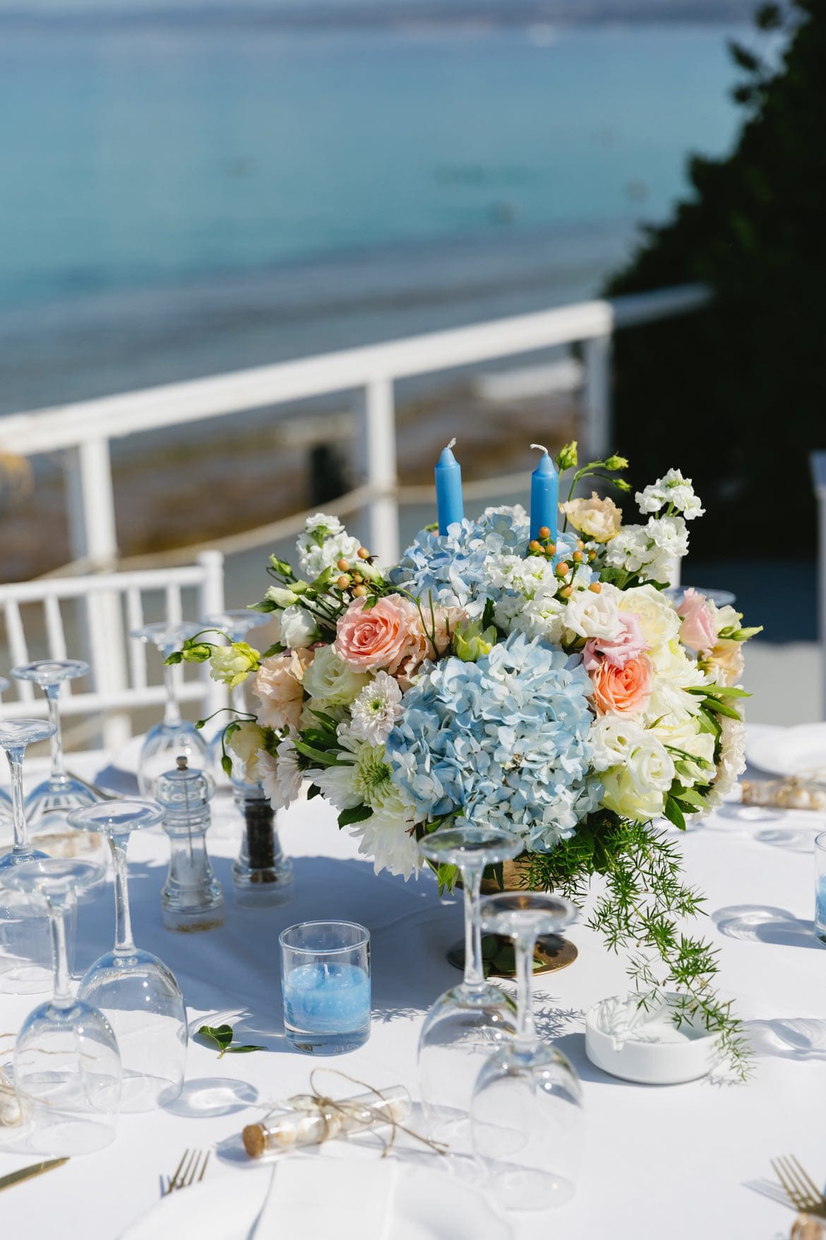 a table with flowers and candles
