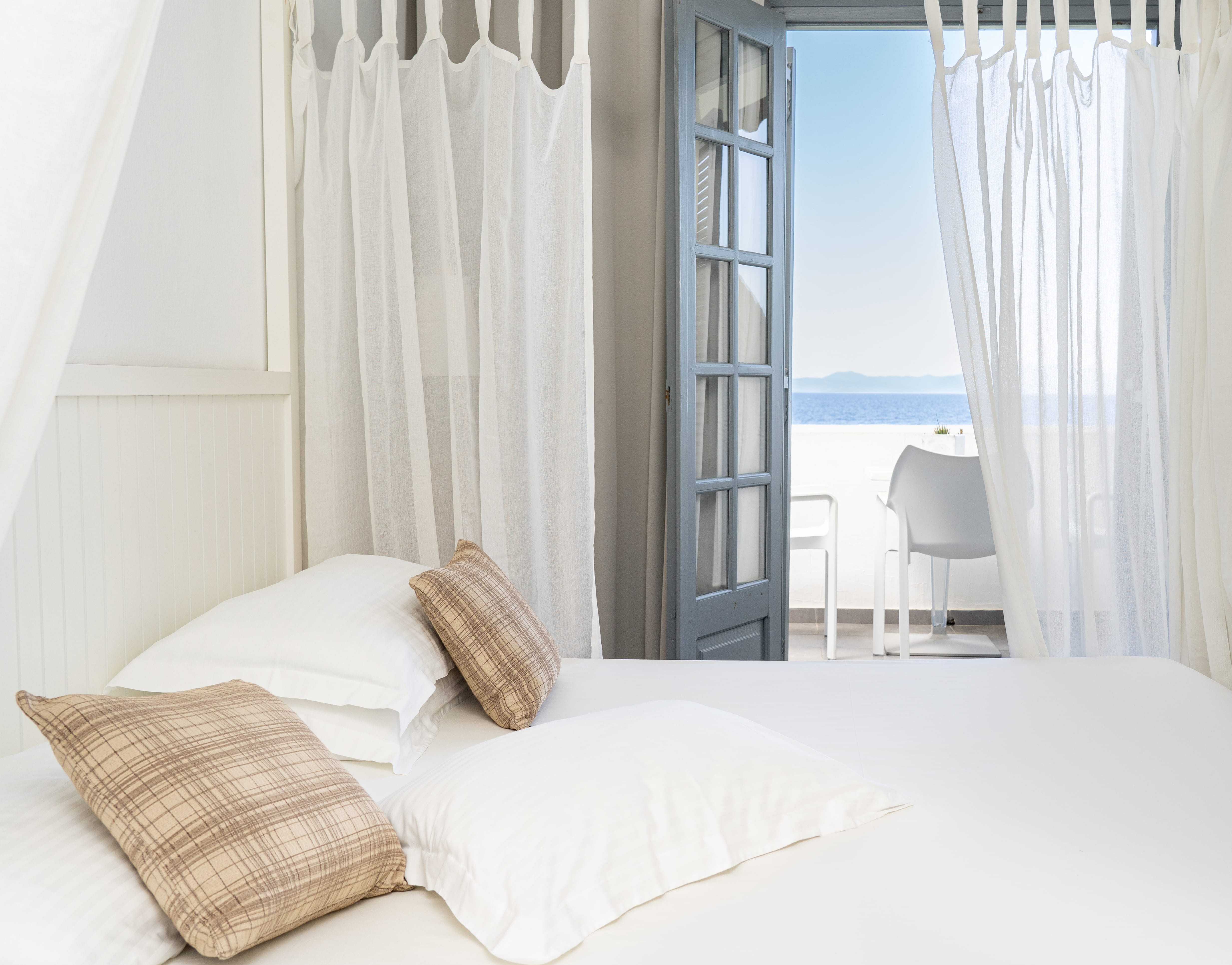 a bed with a white bed spread