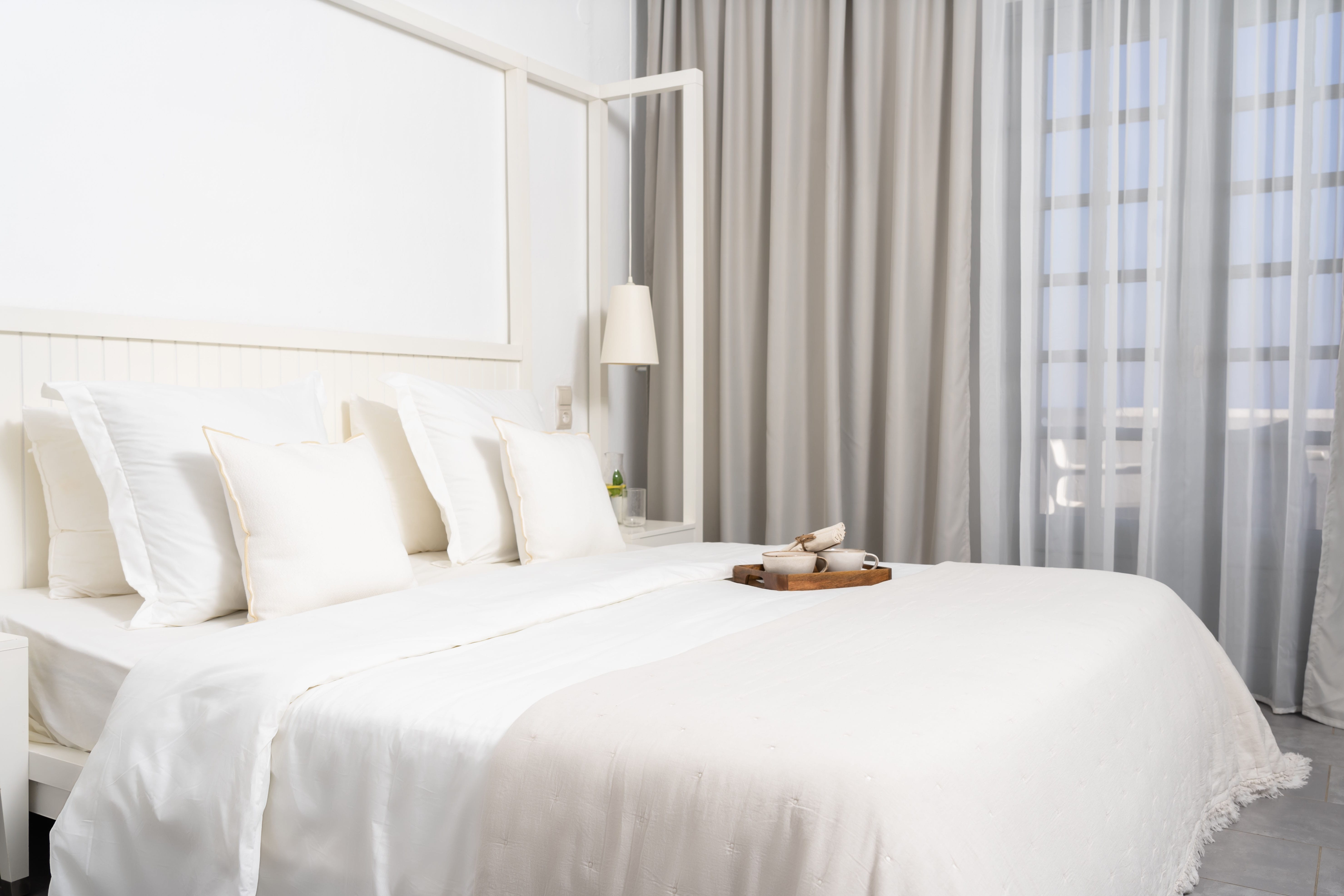 a bed with white sheets