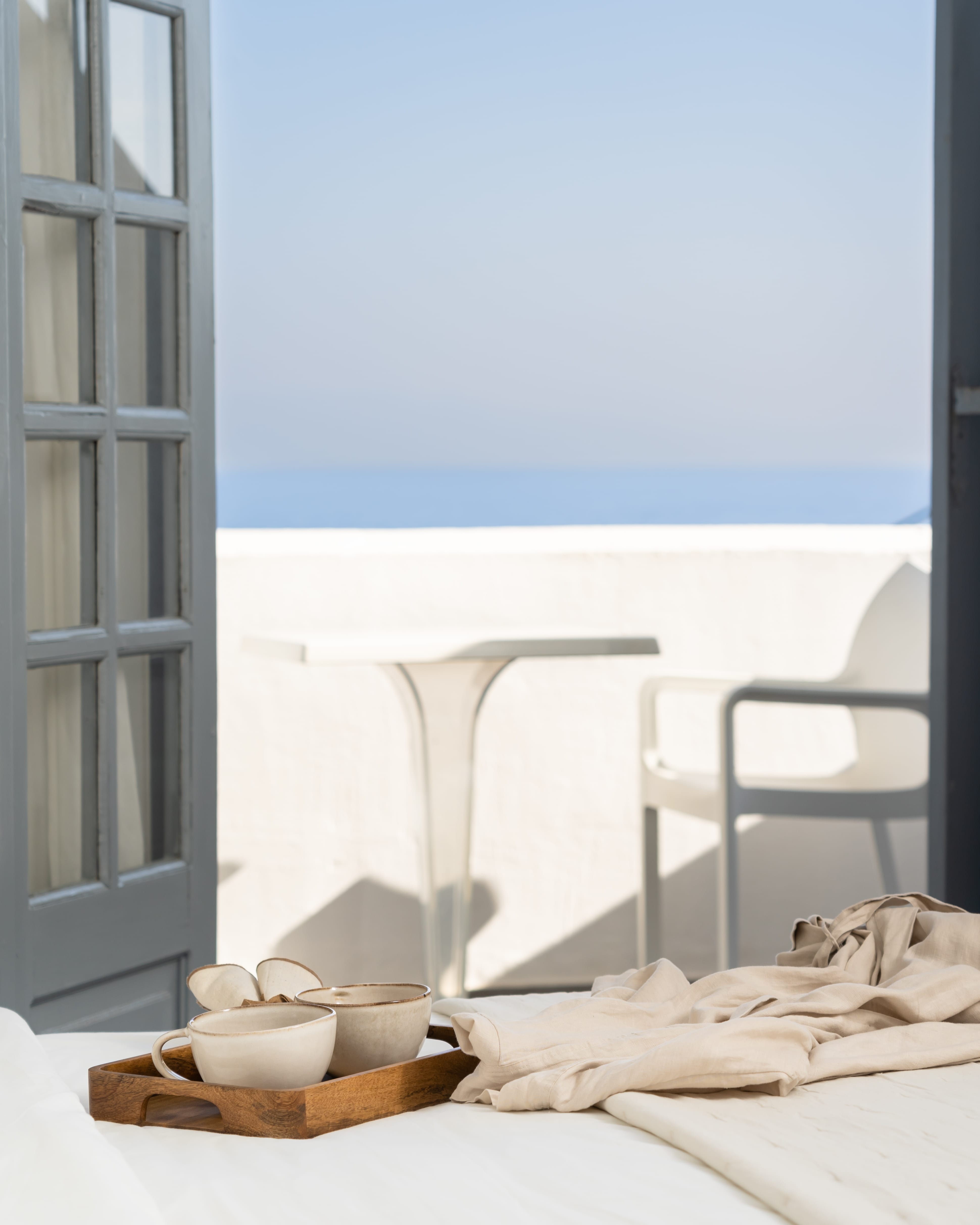 a table and chairs on a balcony