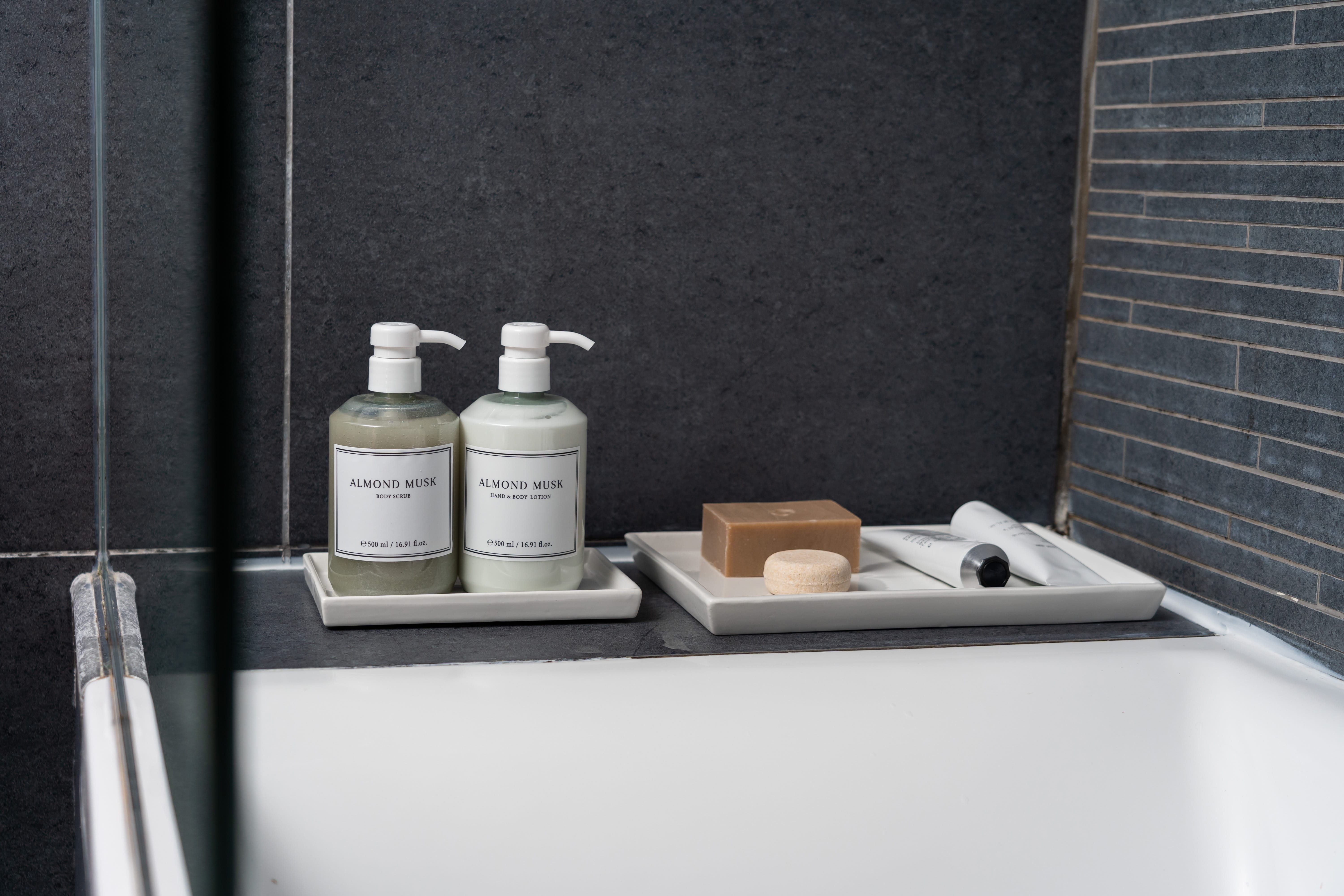 a sink with bottles of soap on it