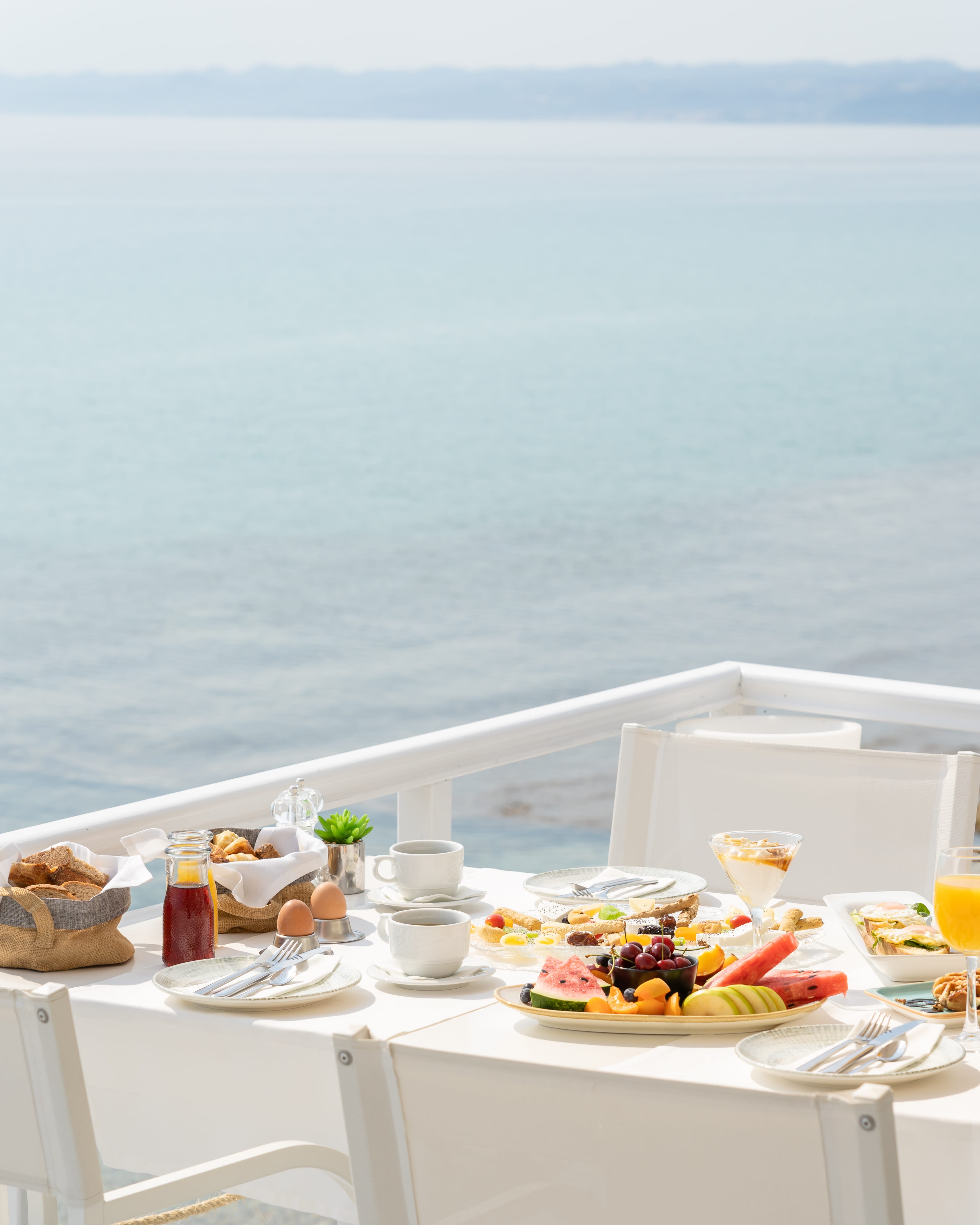 a table with food on it by a body of water