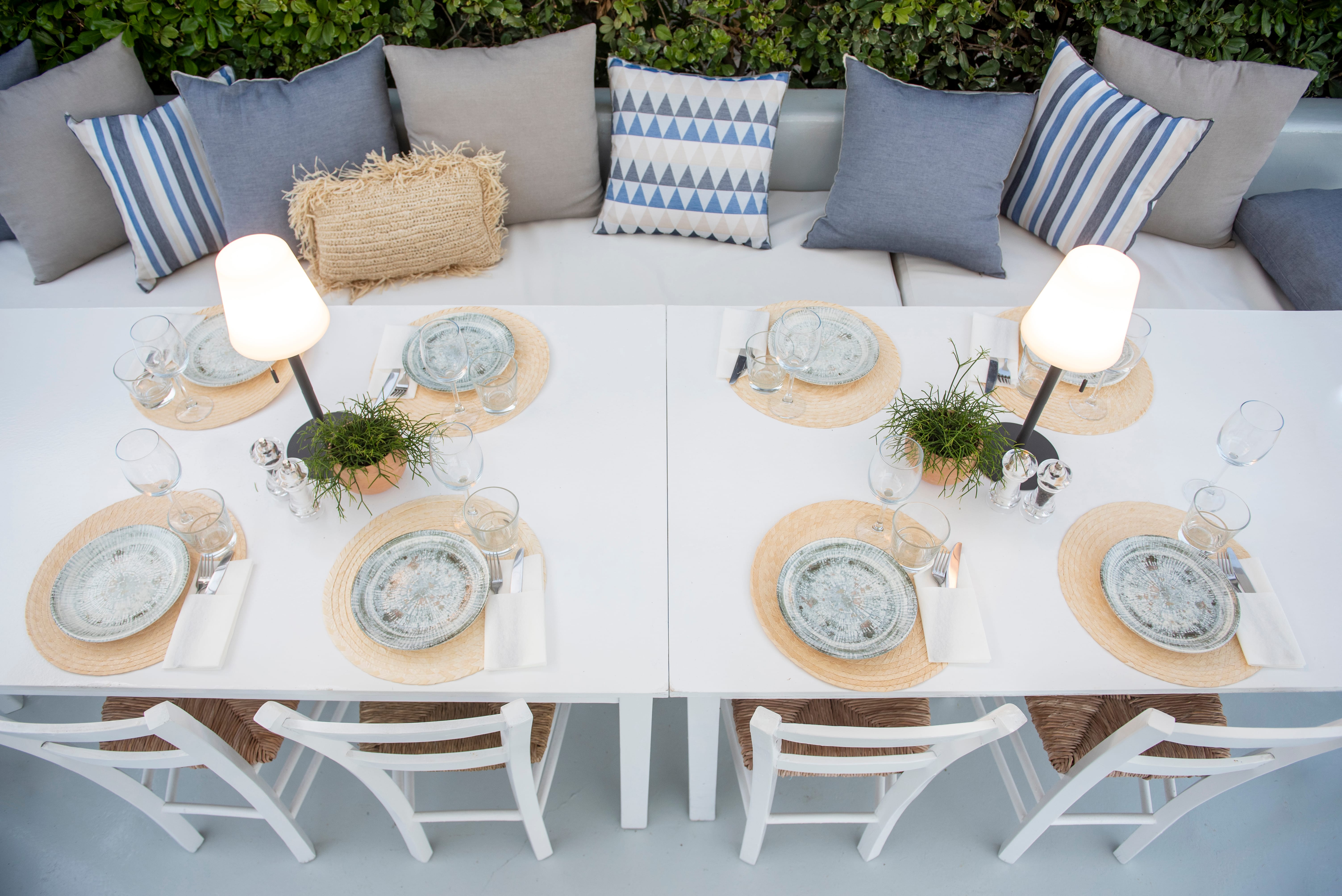 a table with plates and candles on it