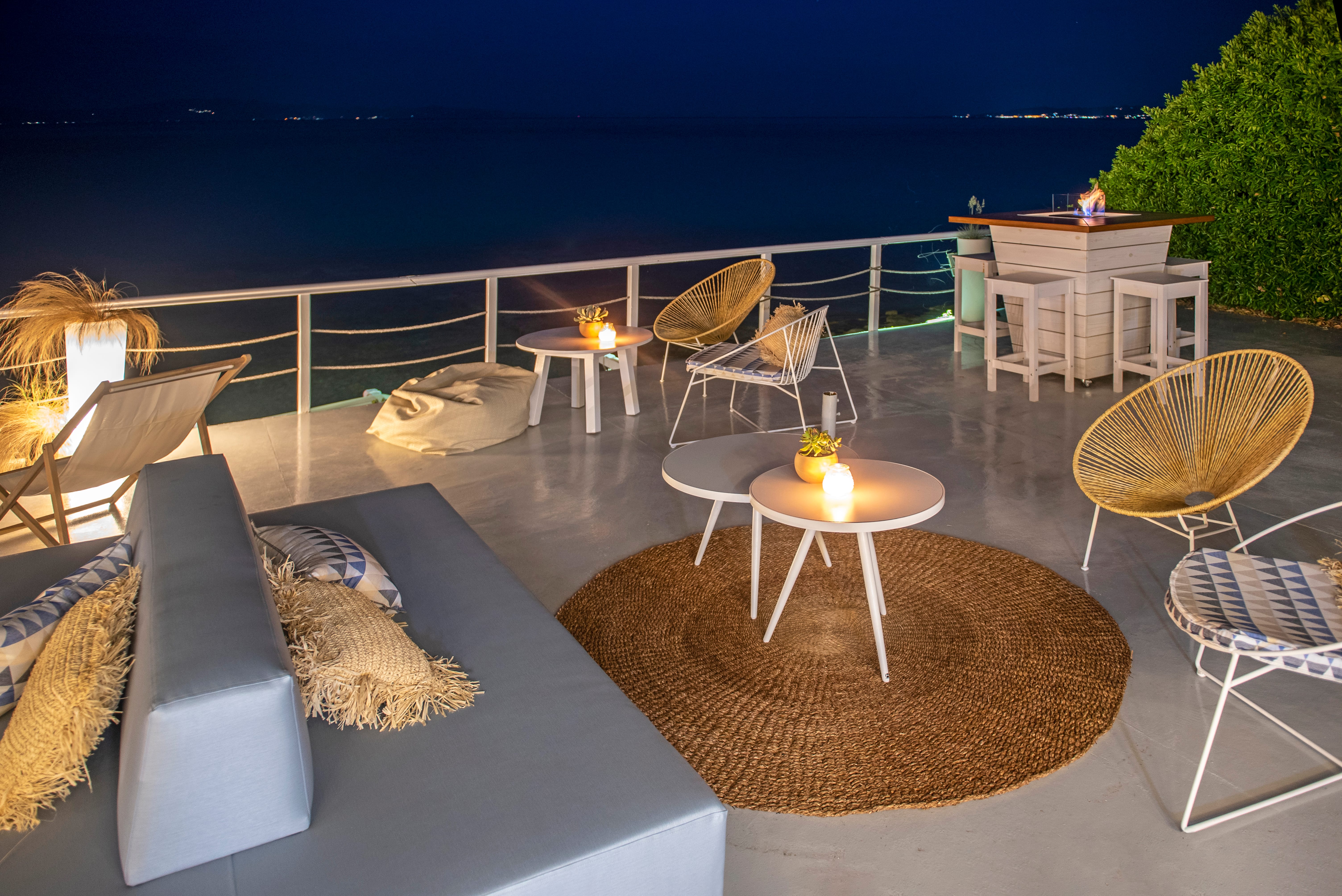 a deck with chairs and a table