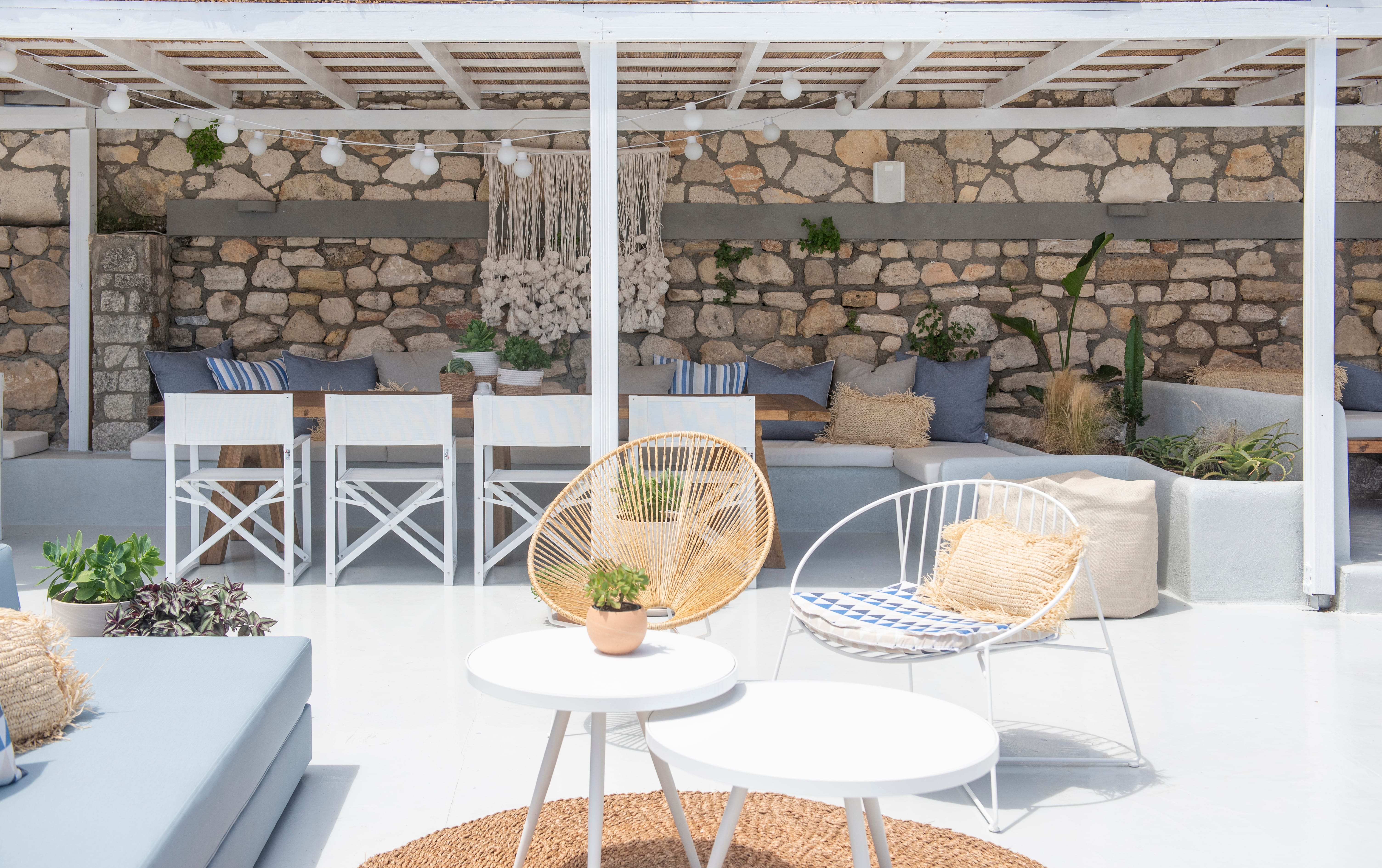 a patio with a table and chairs