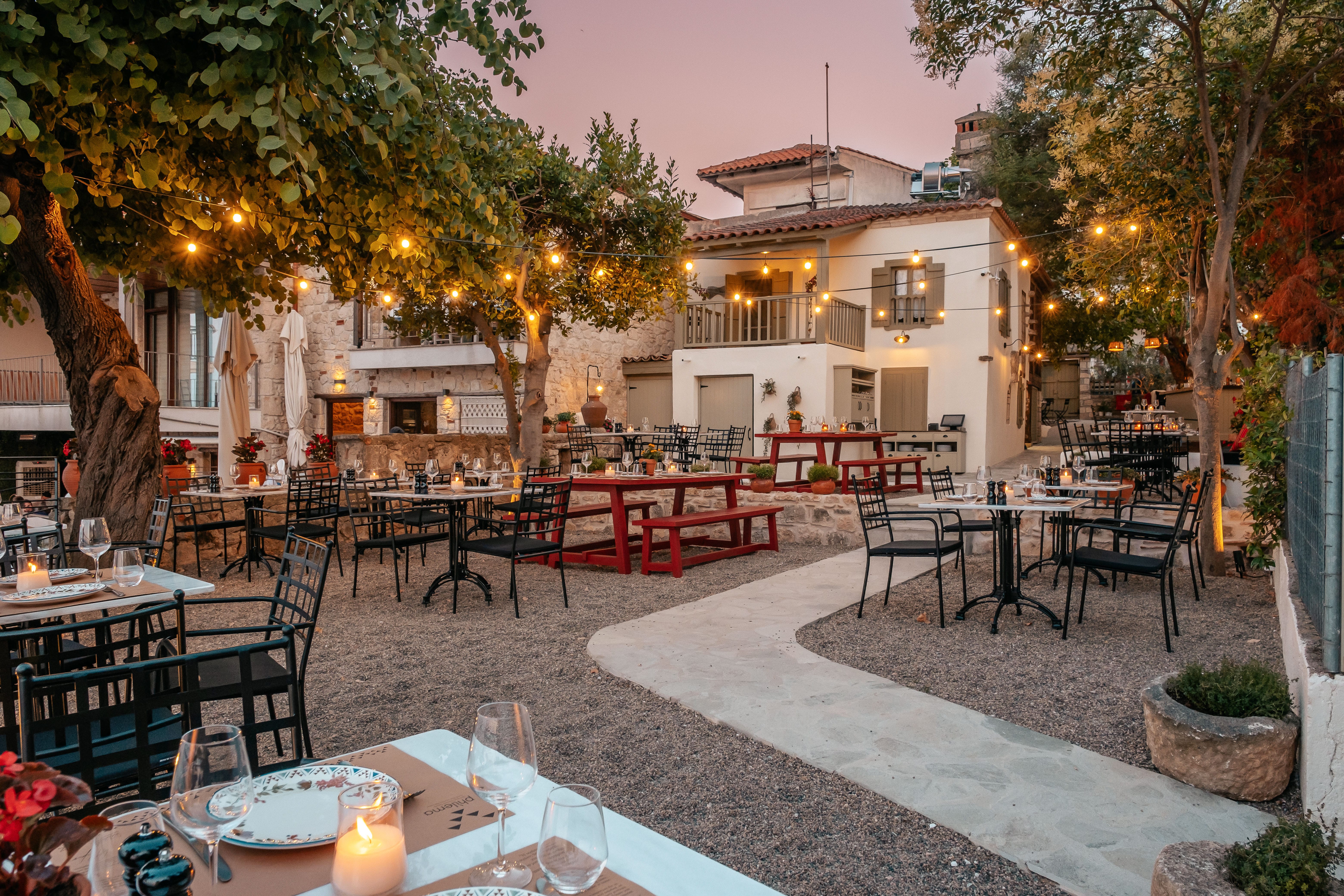 a courtyard with tables and chairs