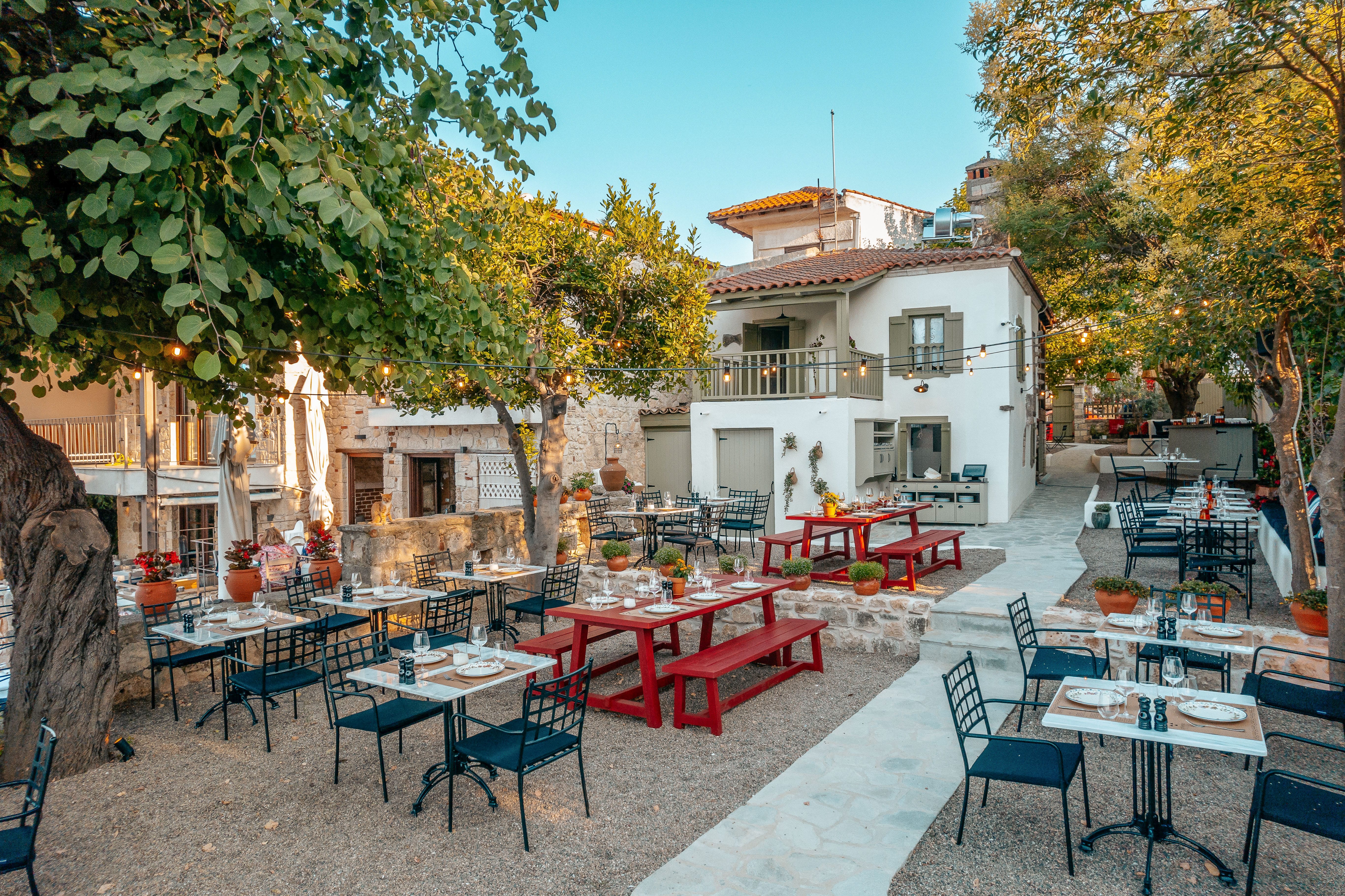 a patio with tables and chairs