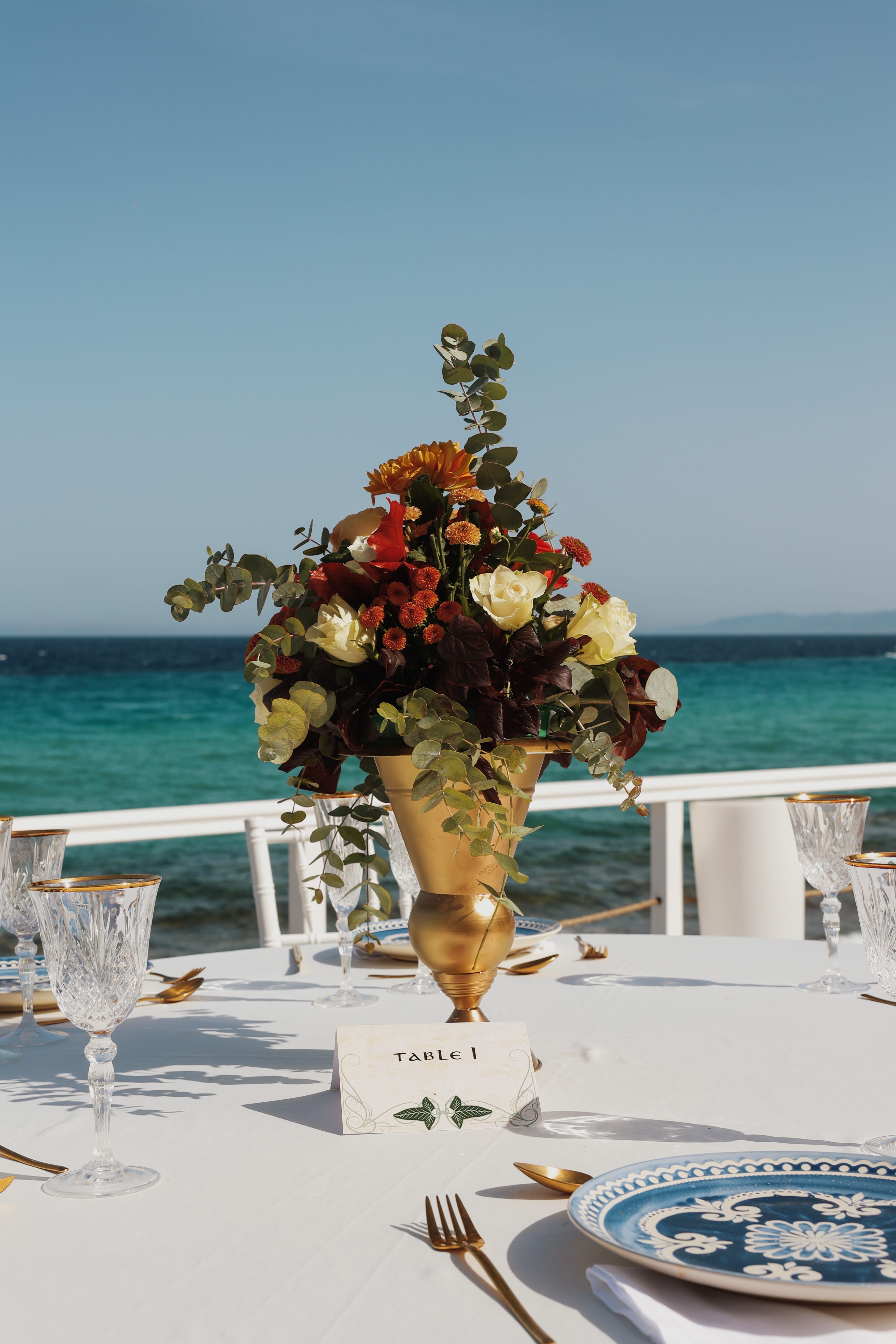 a vase with flowers on a table