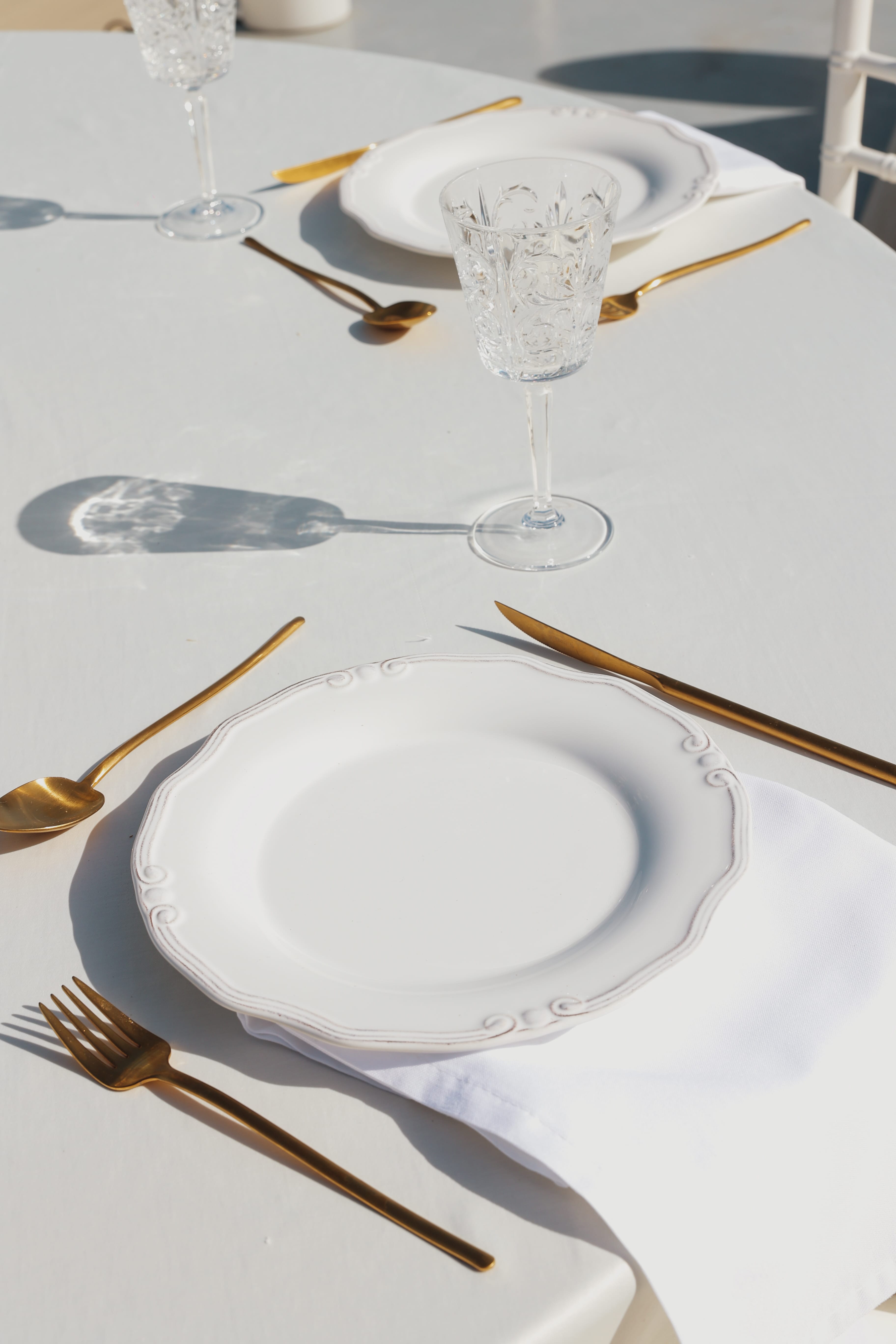 a set of plates and silverware on a table