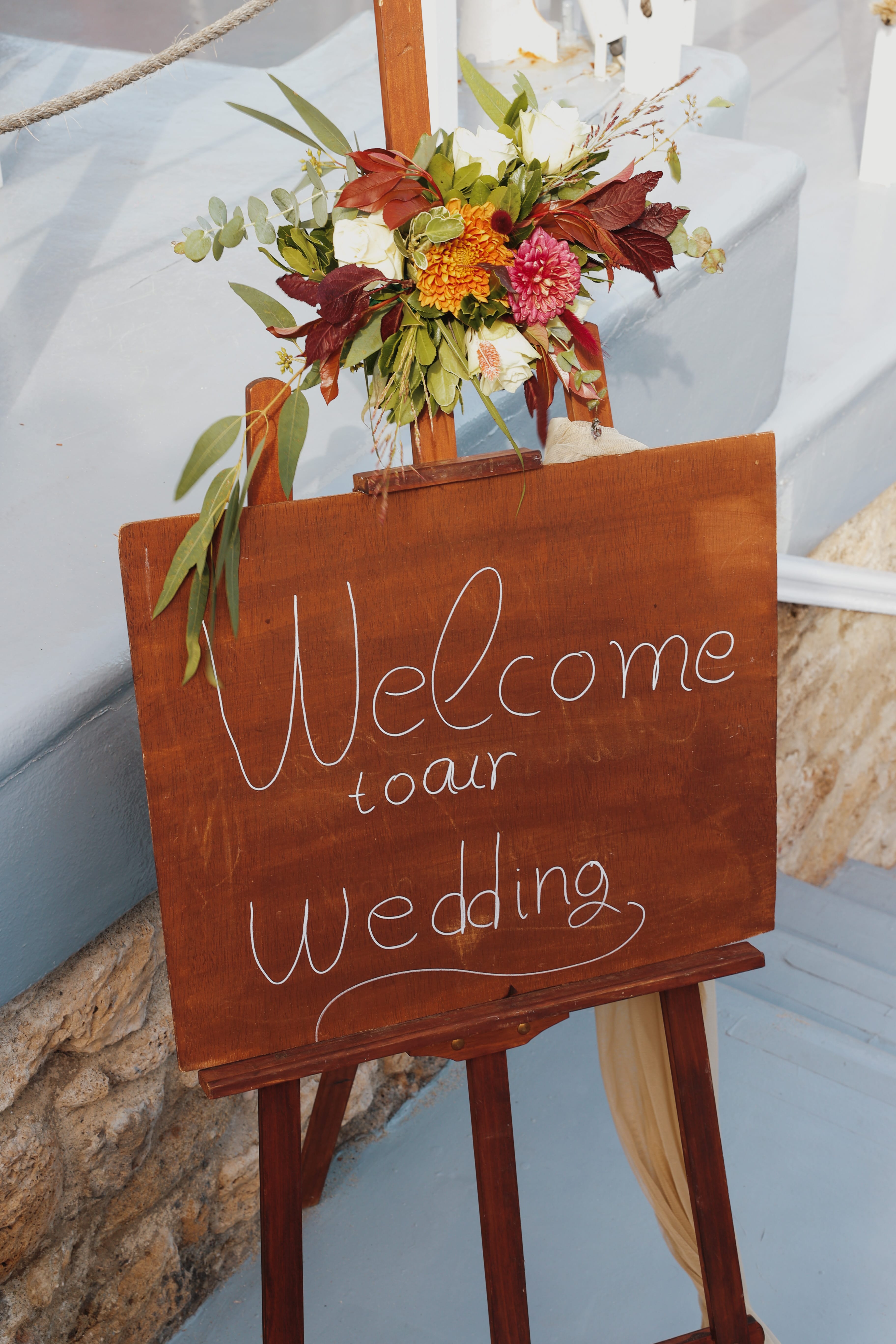 a sign with flowers on it