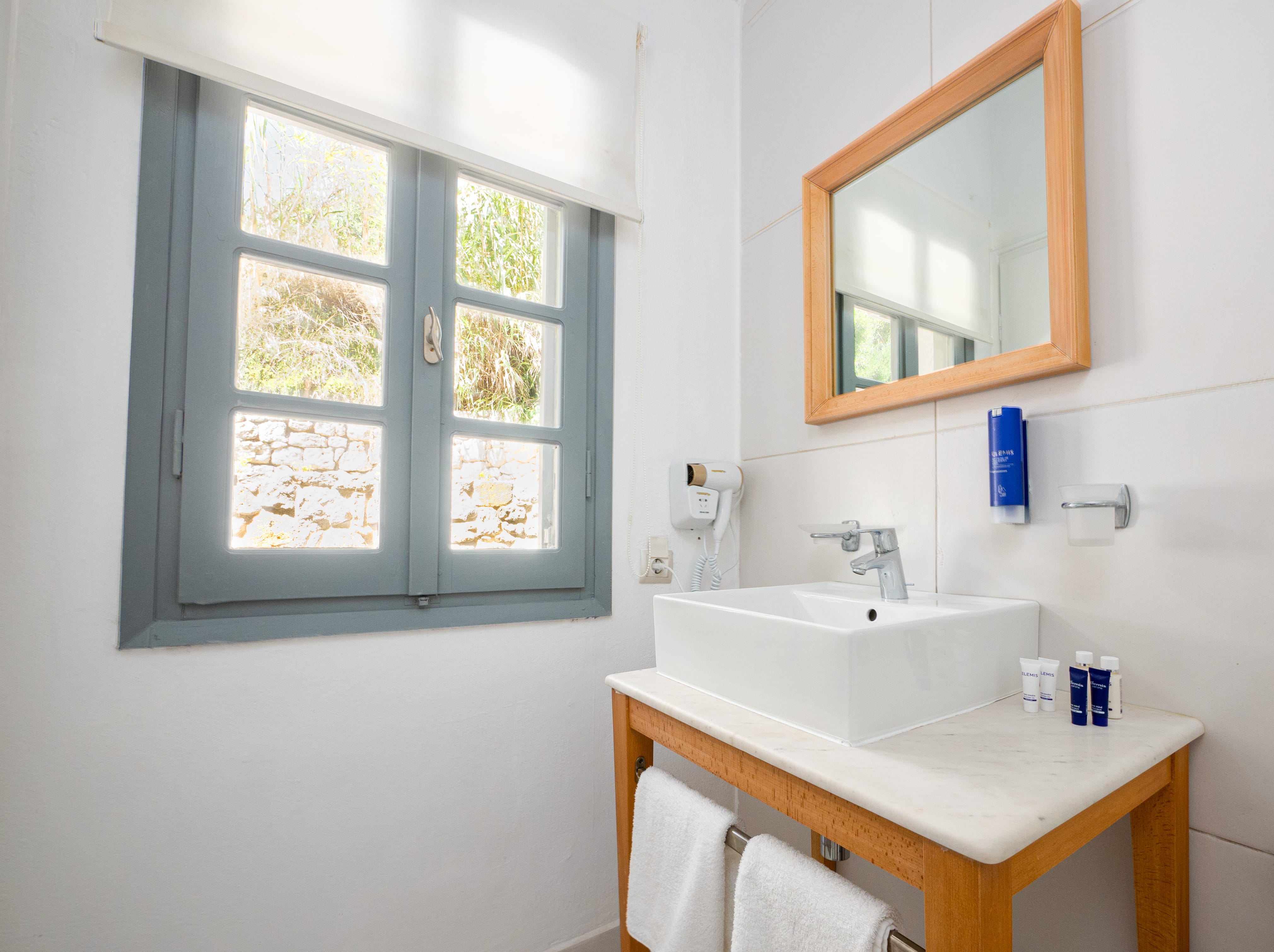 a bathroom with a mirror and sink