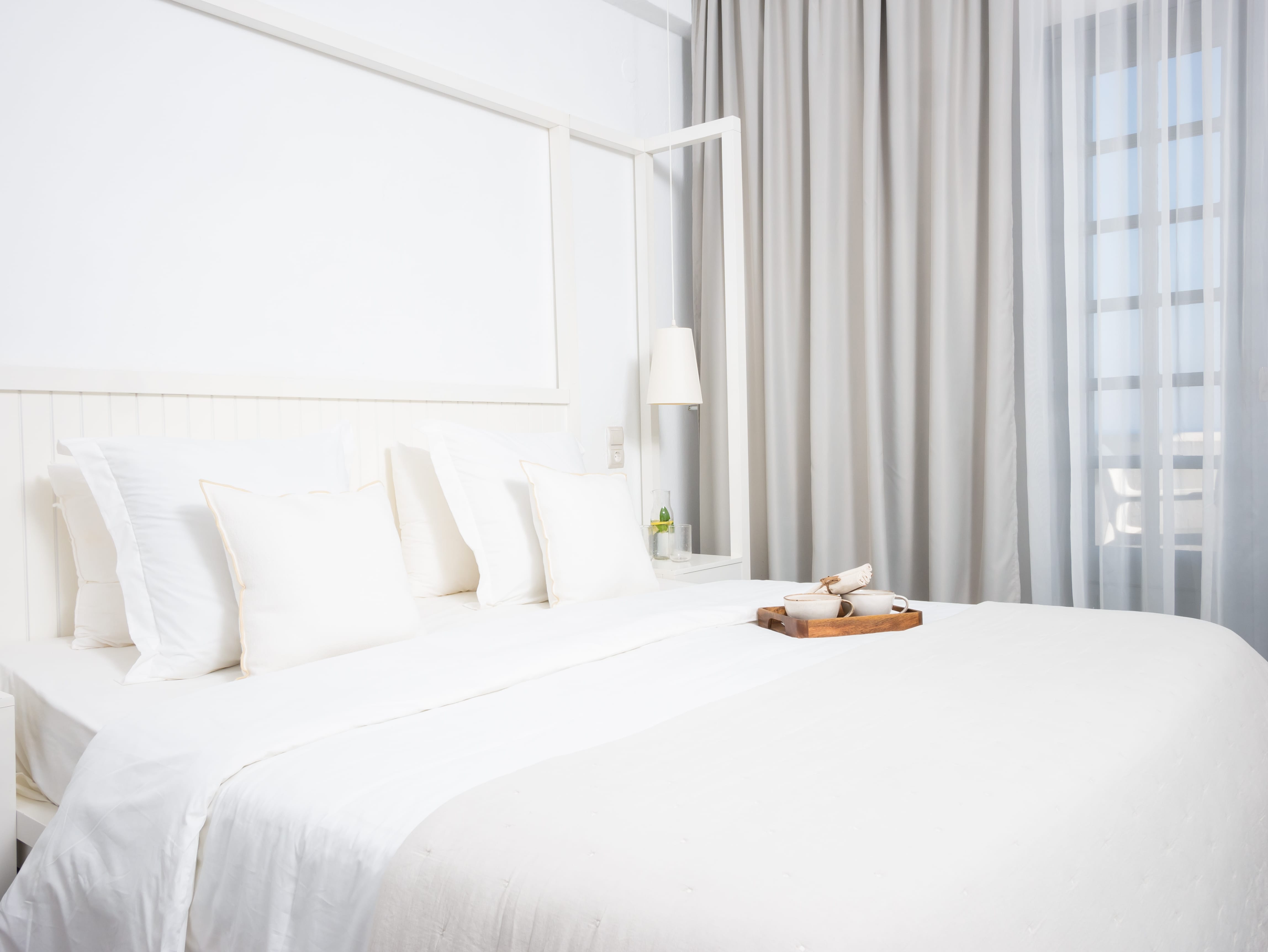 a bed with white sheets