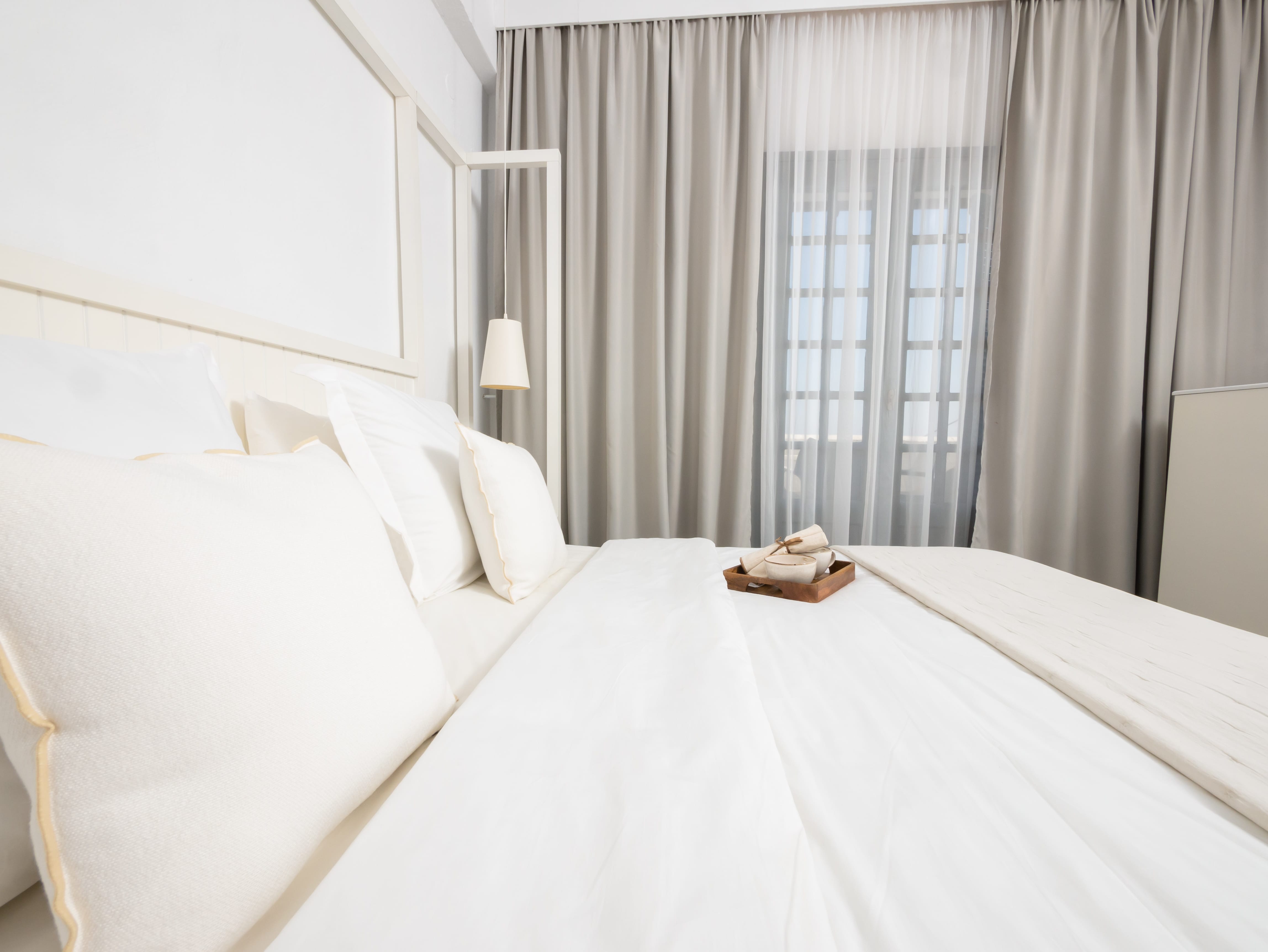 a bed with white sheets