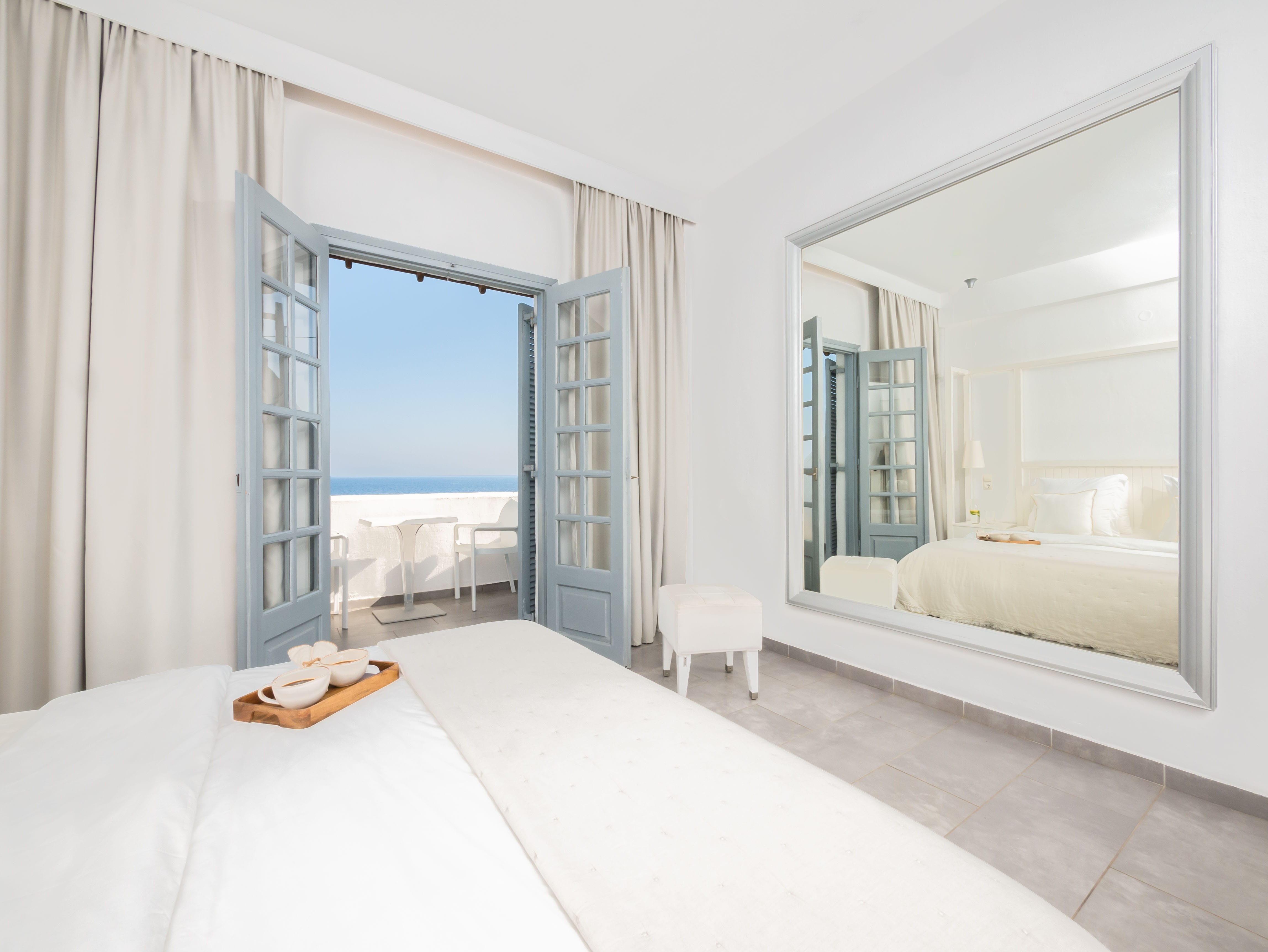 a bedroom with a large window