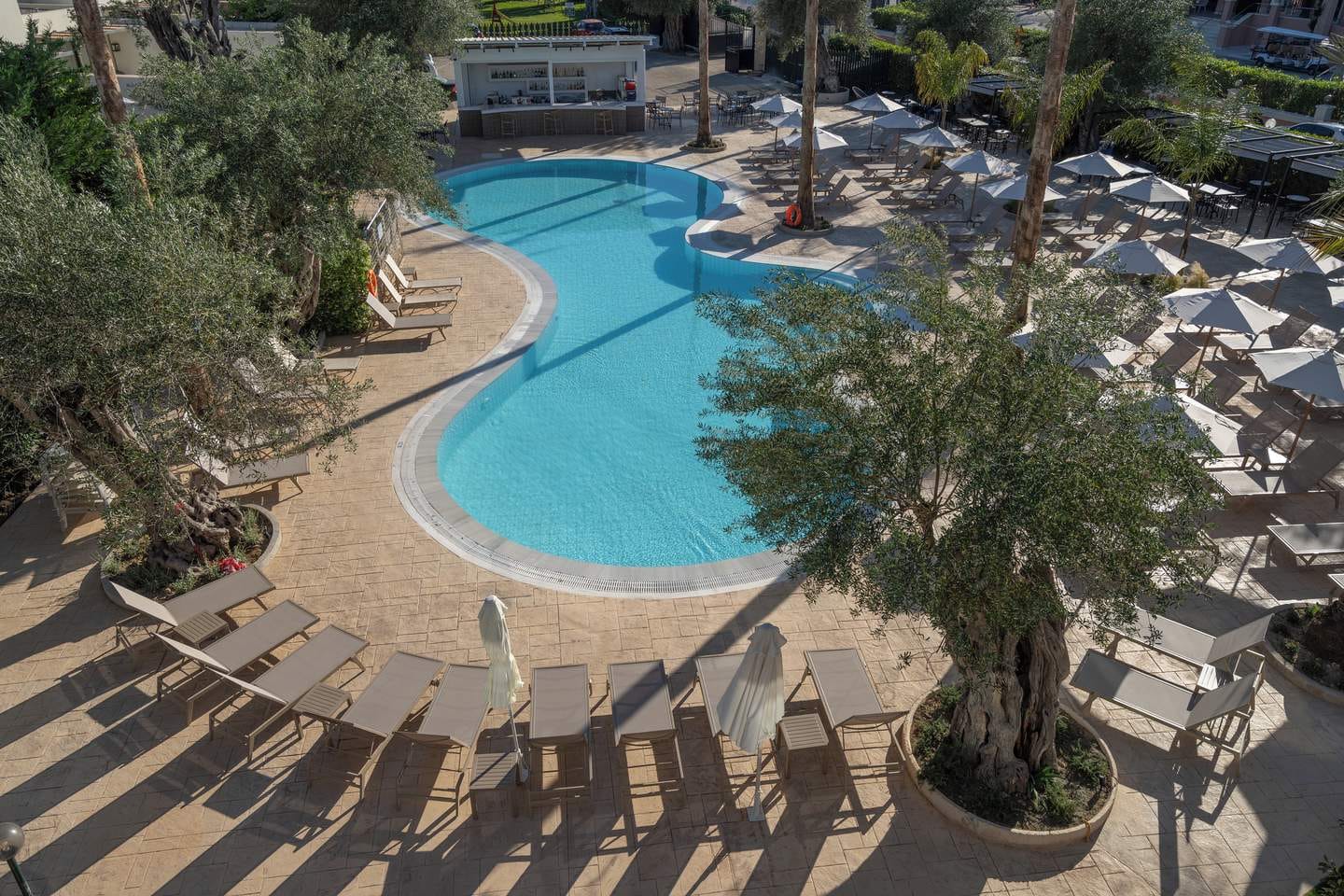 a pool with chairs around it