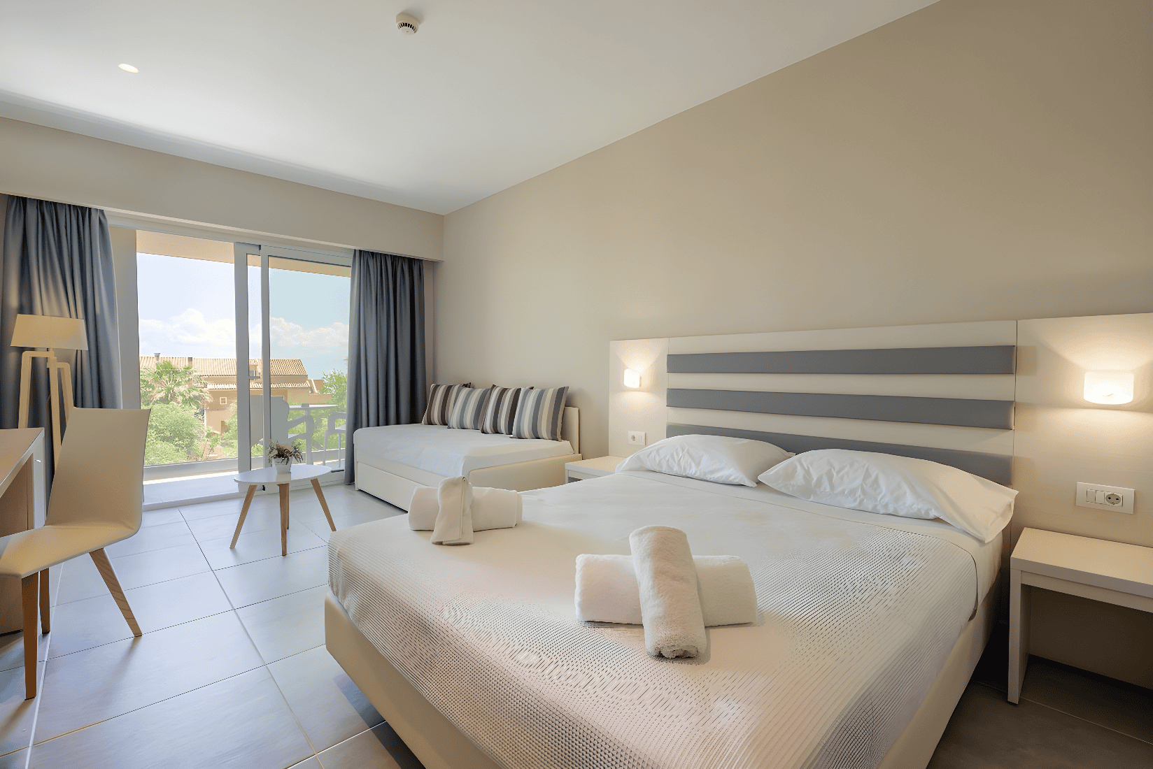 a bedroom with a bed and a couch