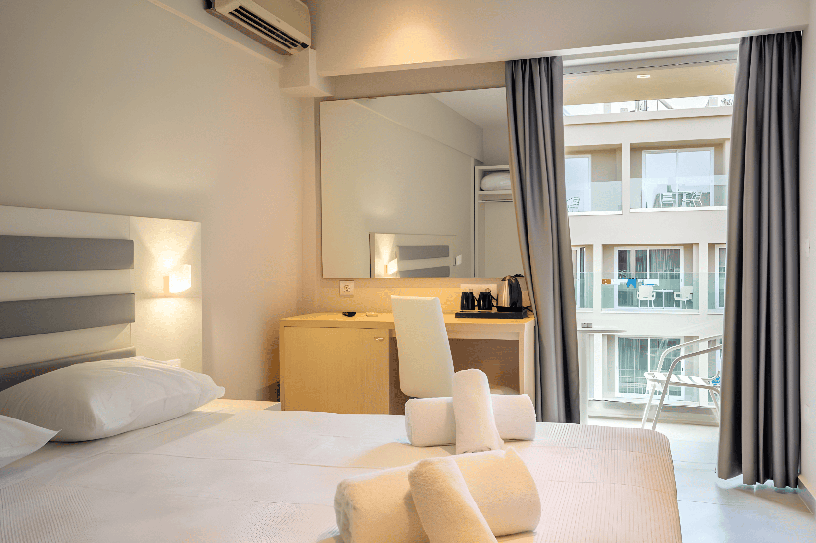 a hotel room with a large bed