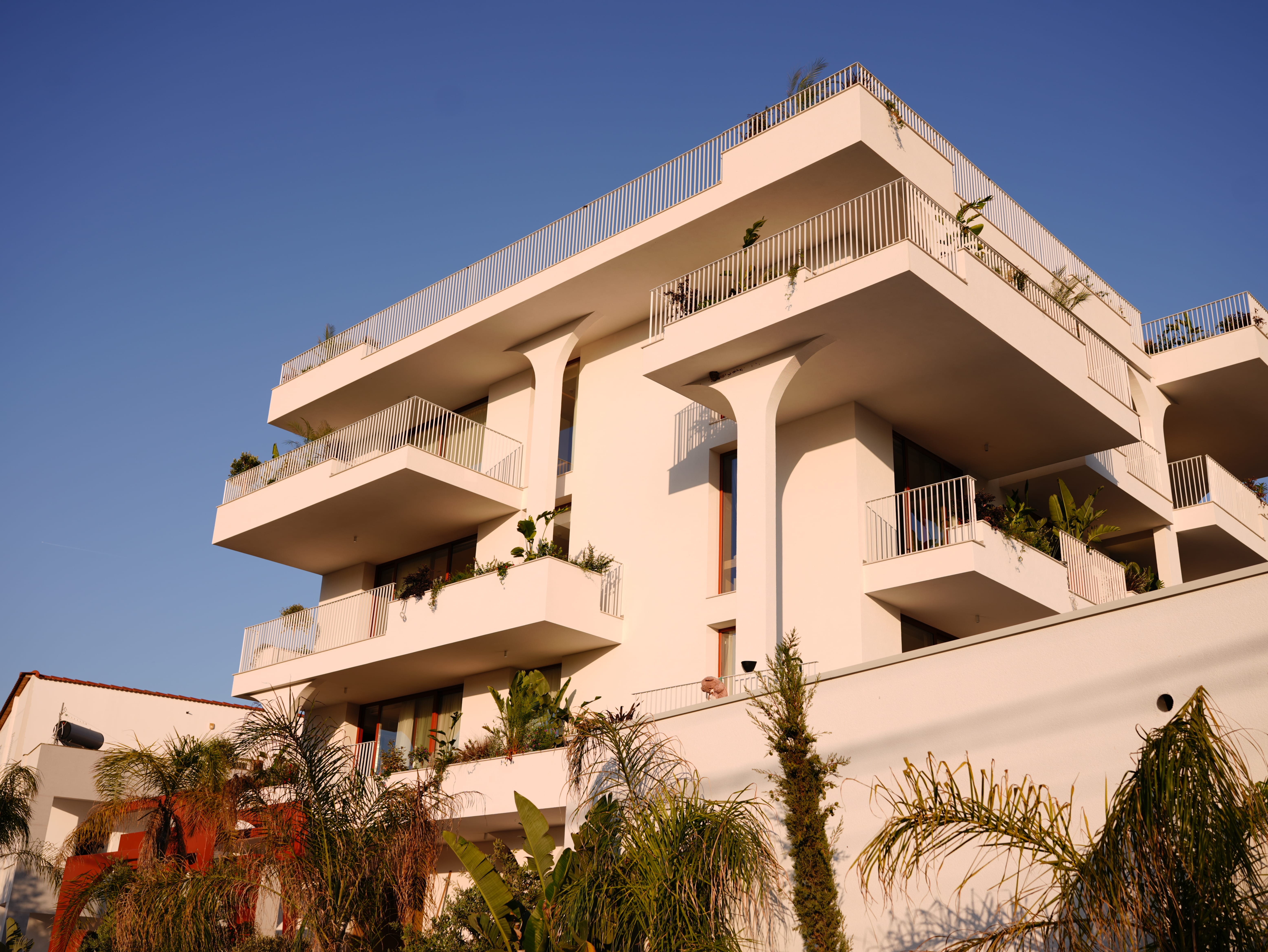 a white building with balconies