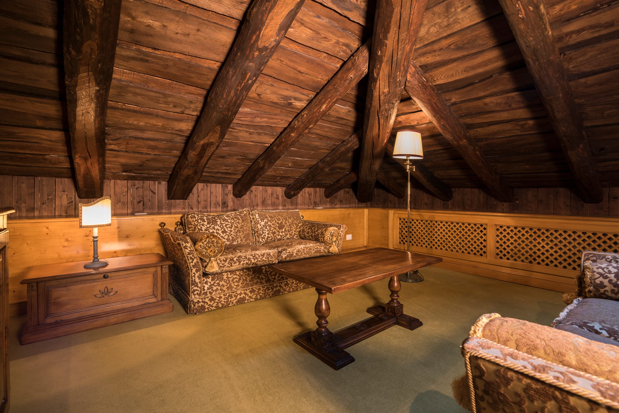 a room with a table and couches