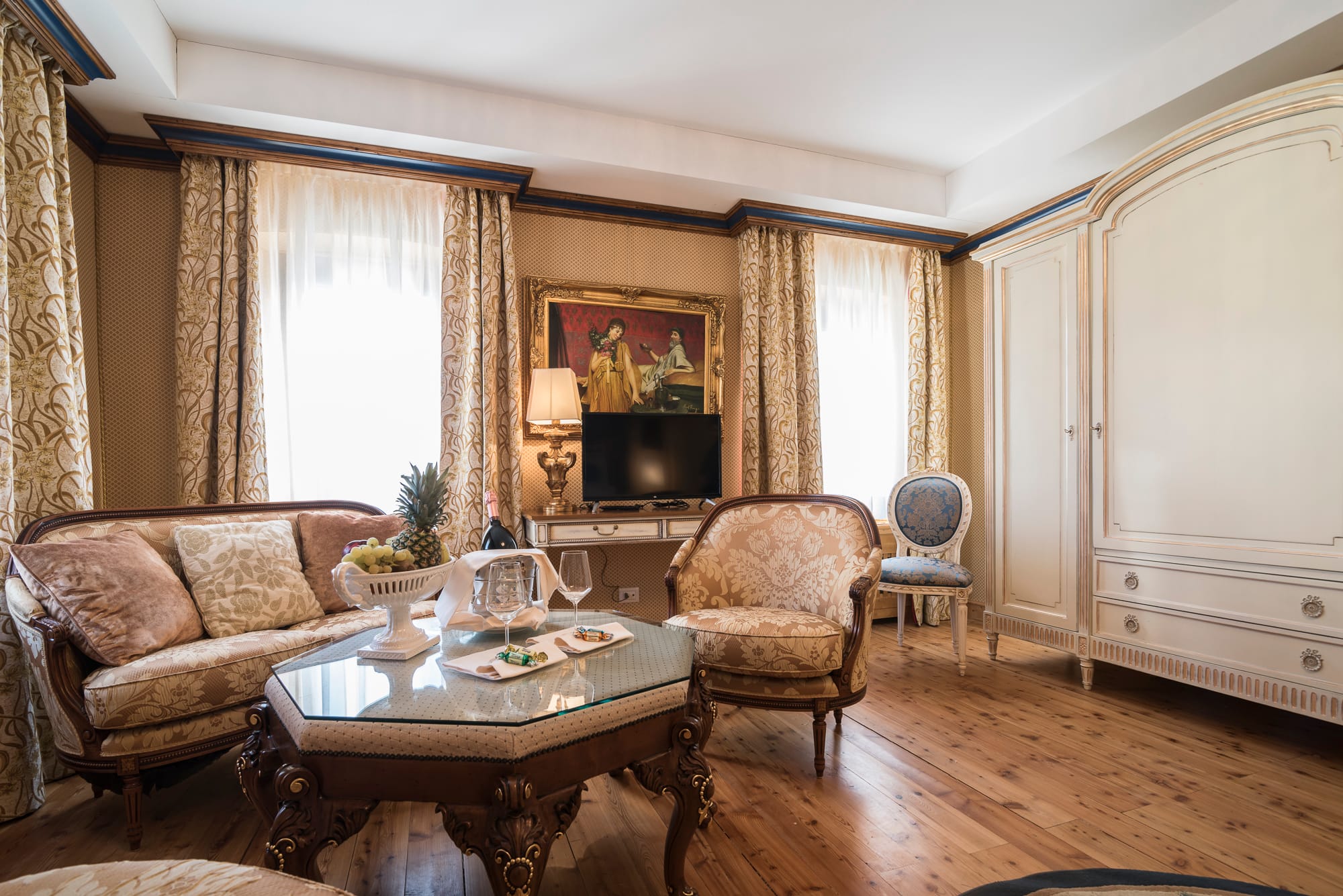 a living room with a table and chairs